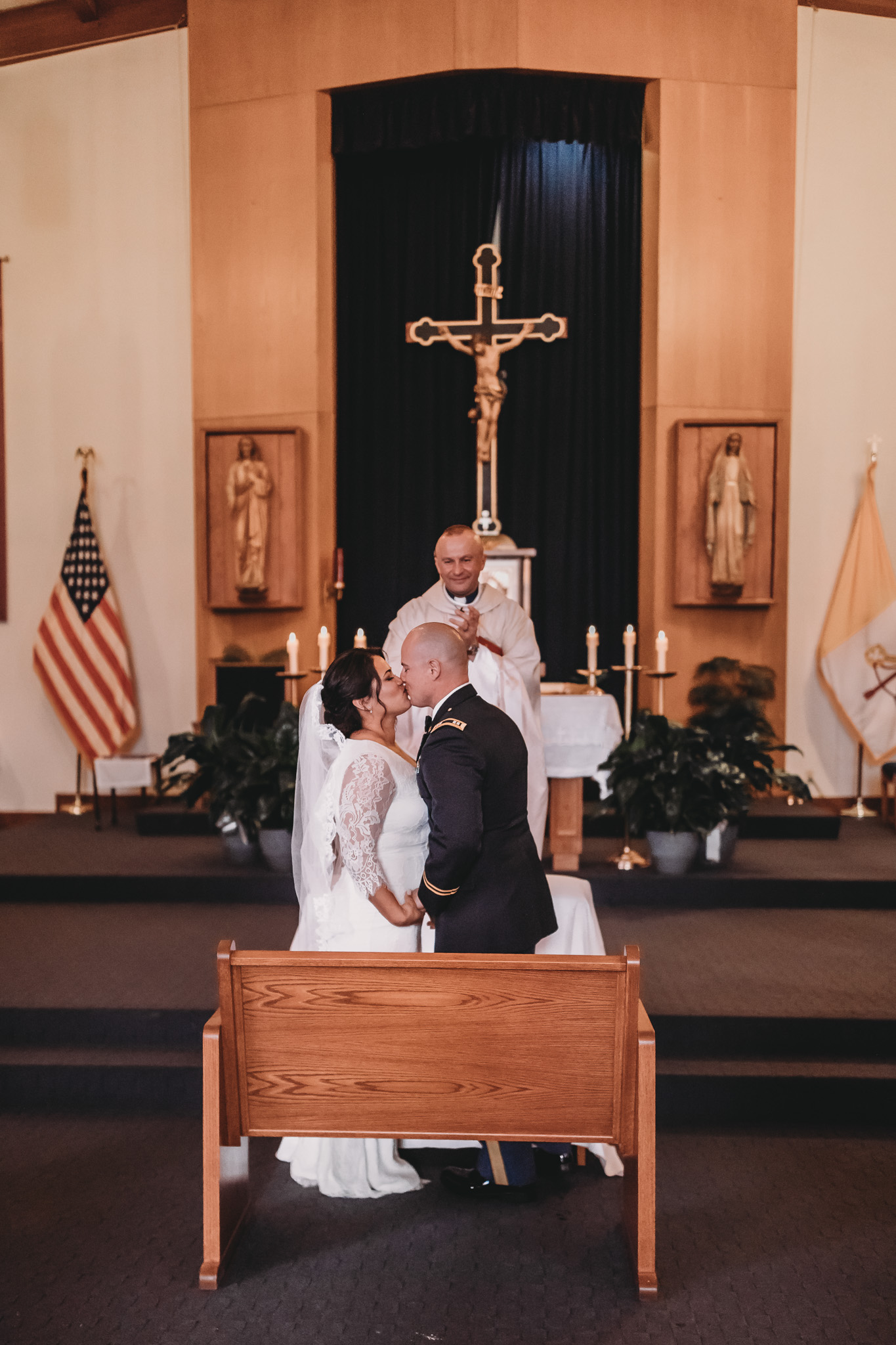 Bride and Groom Kissing in Church