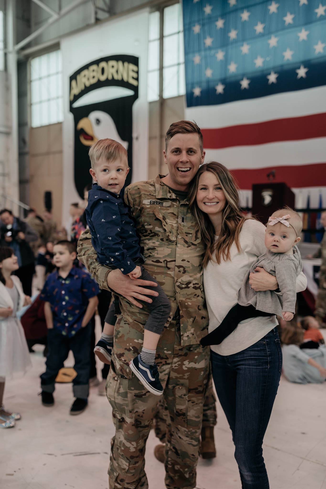Familing welcoming home their soldier from deployment