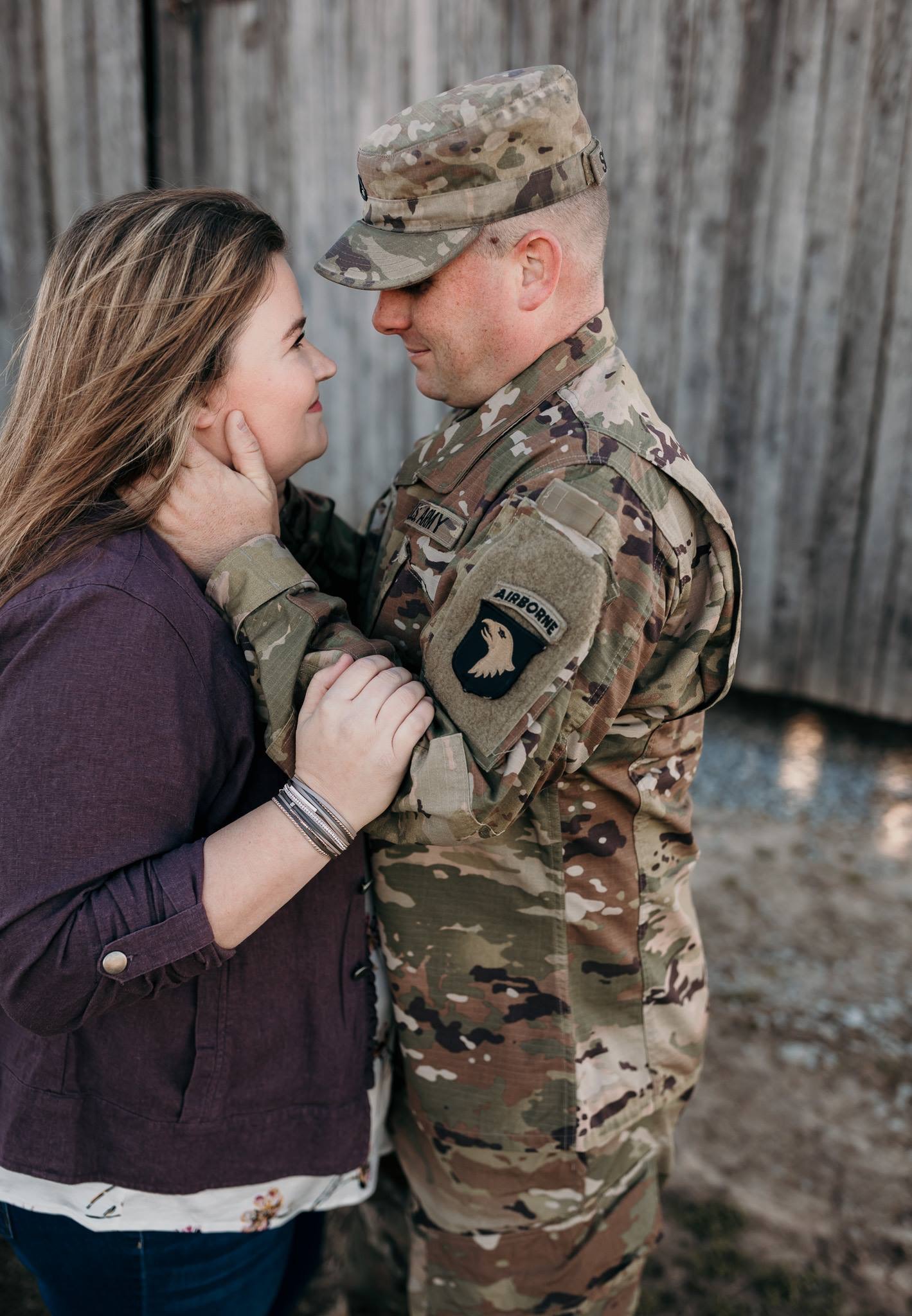 Military couple looking at each other embracing