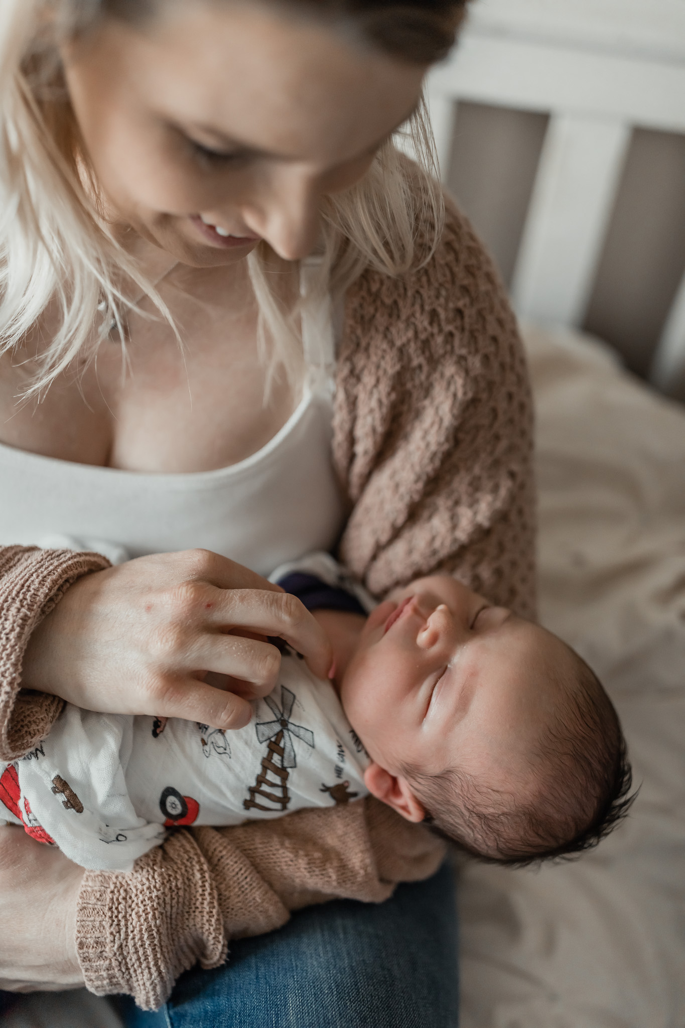 mom looking at newborn son