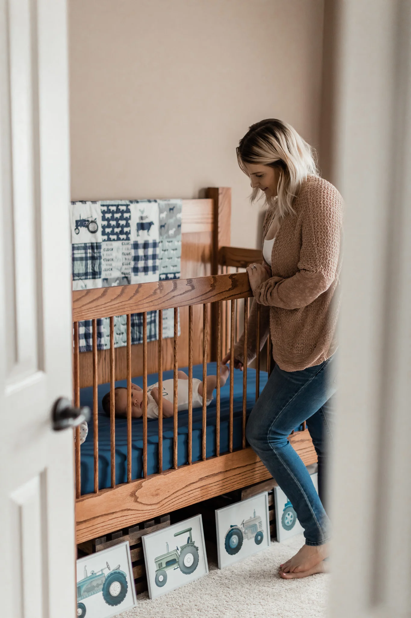 mom looking at newborn baby boy