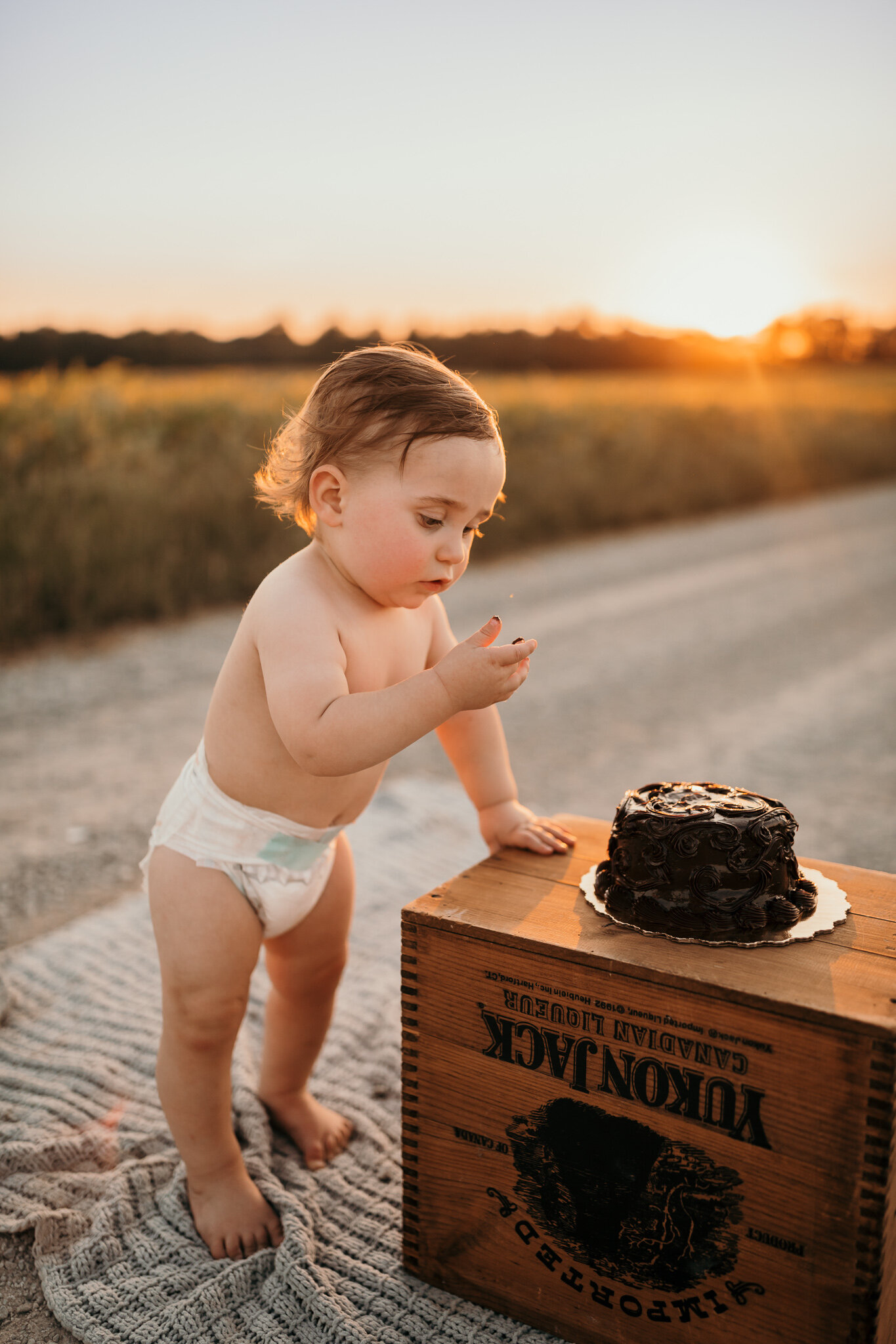 little boy trying first cake