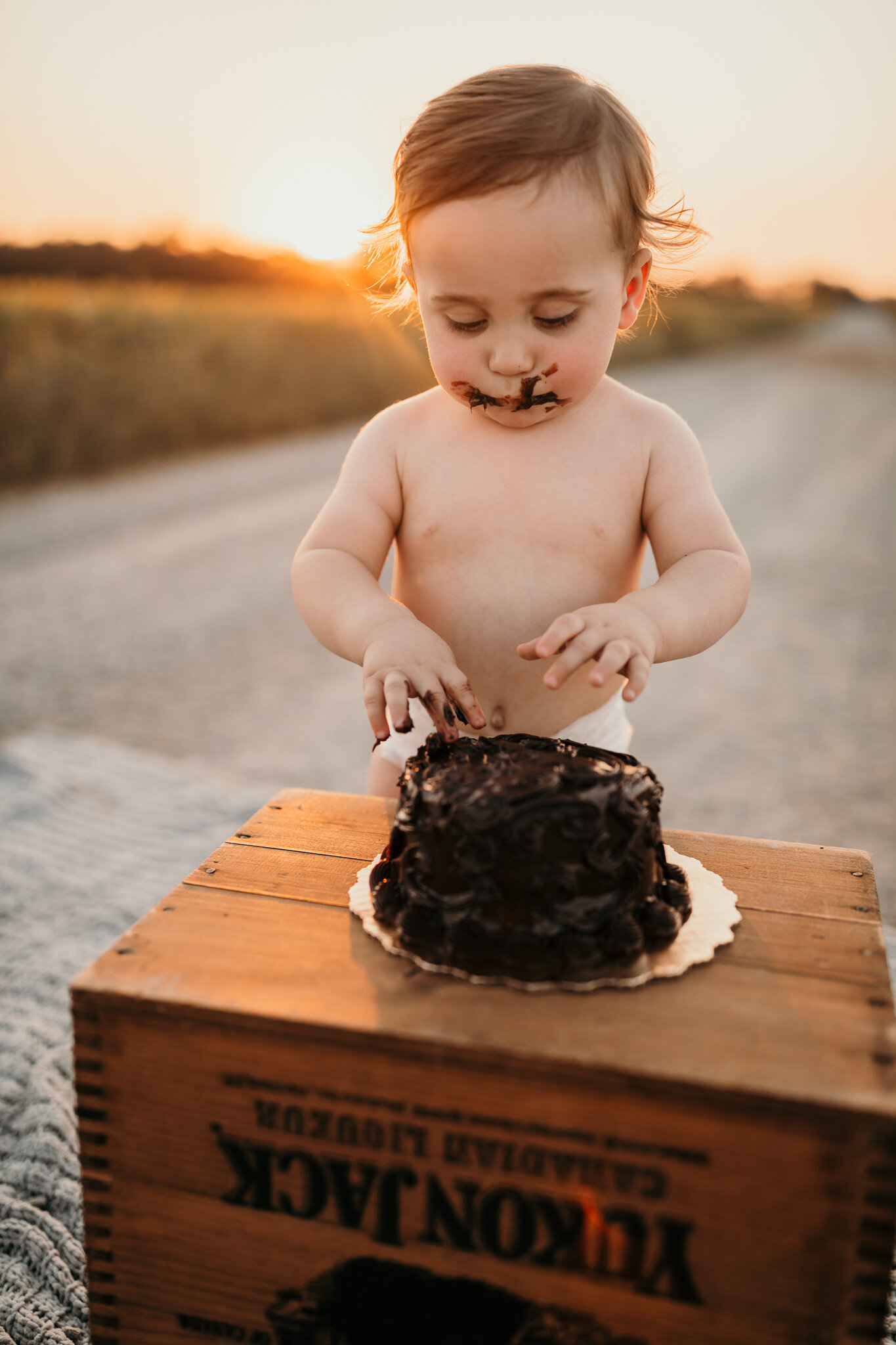 outdoor birthday cake smash session one year old