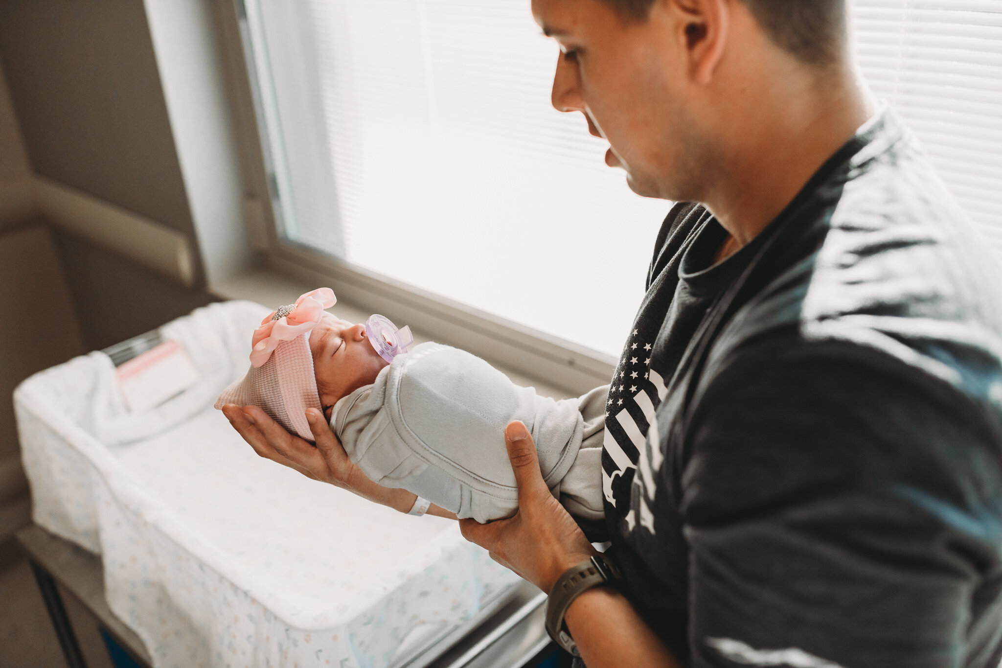 dad holding daughter first time