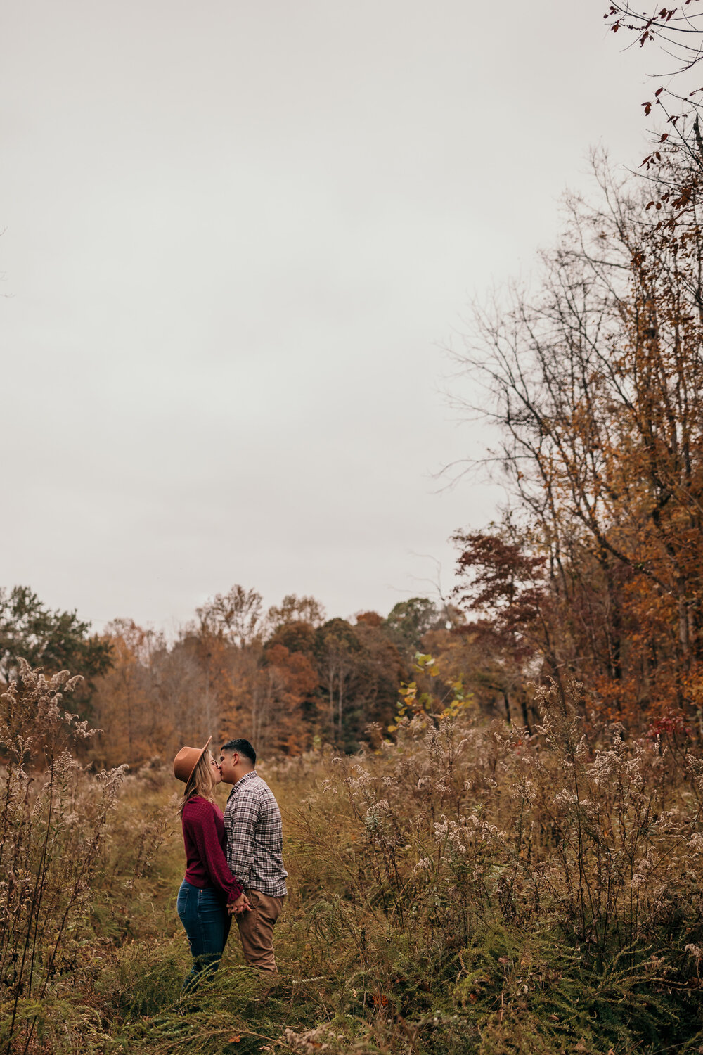 engaged couple kissing