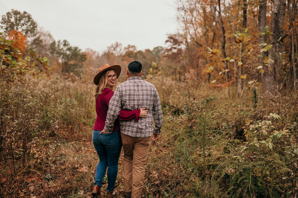 couple walking away from photographer