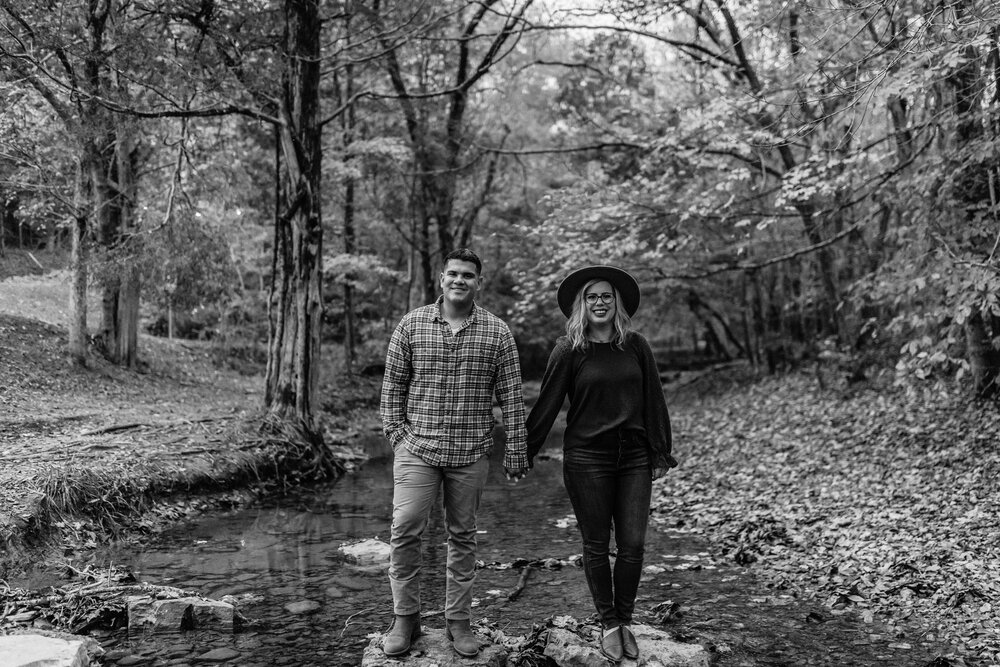 couple standing on rocks pose