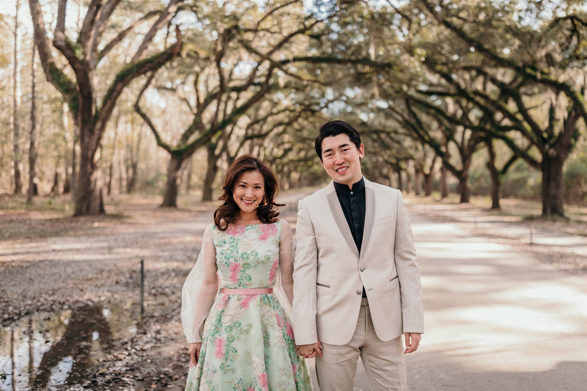 couple with historic savannah moss trees