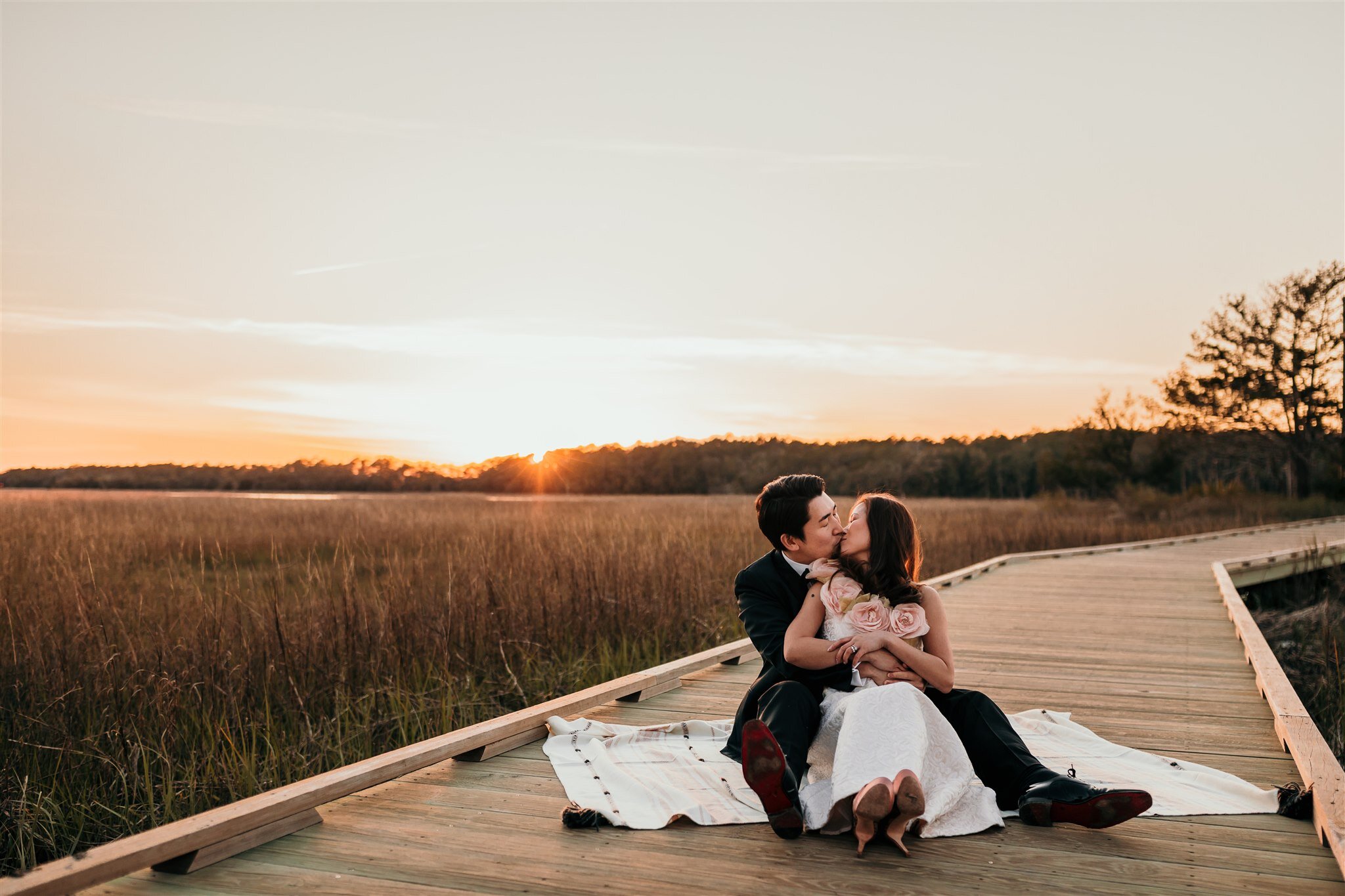 couple on blanket in sunset