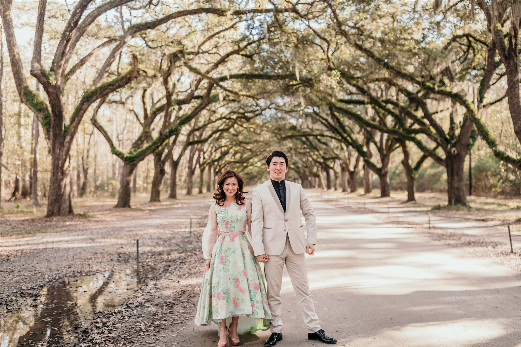 couple in savannah ga historic moss lined trees