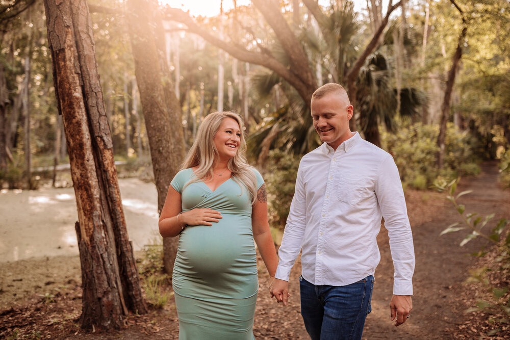 couple expecting baby walking