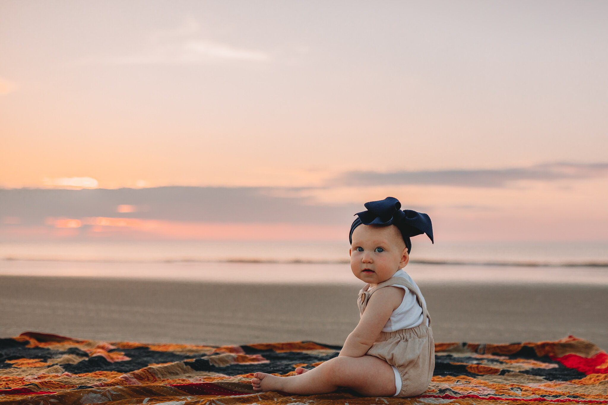 baby on the beach at sunrise in savannah