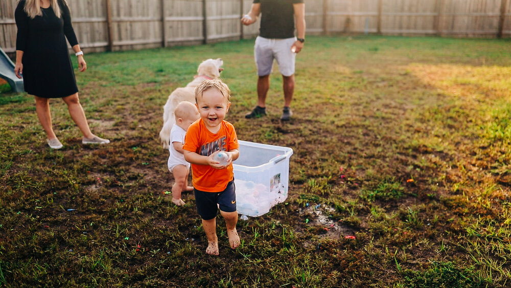 toddler throwing water balloon