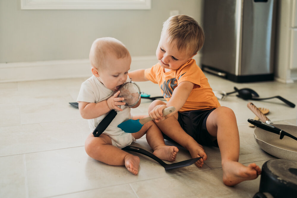 brothers playing in kitchen