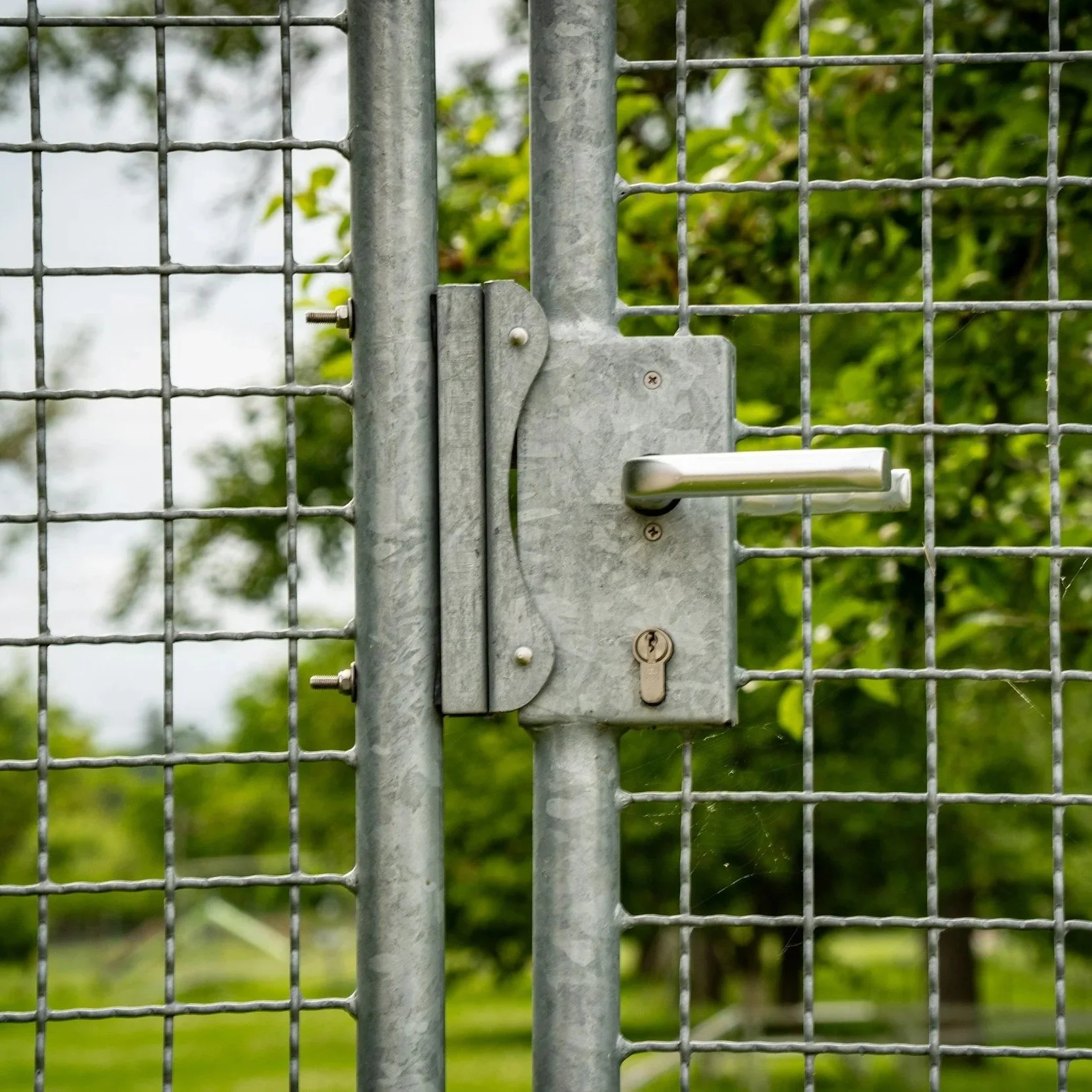 Security Upgrades for Chain Link Fences: Barbed Wire, Razor Wire, and Anti-Climb Additions