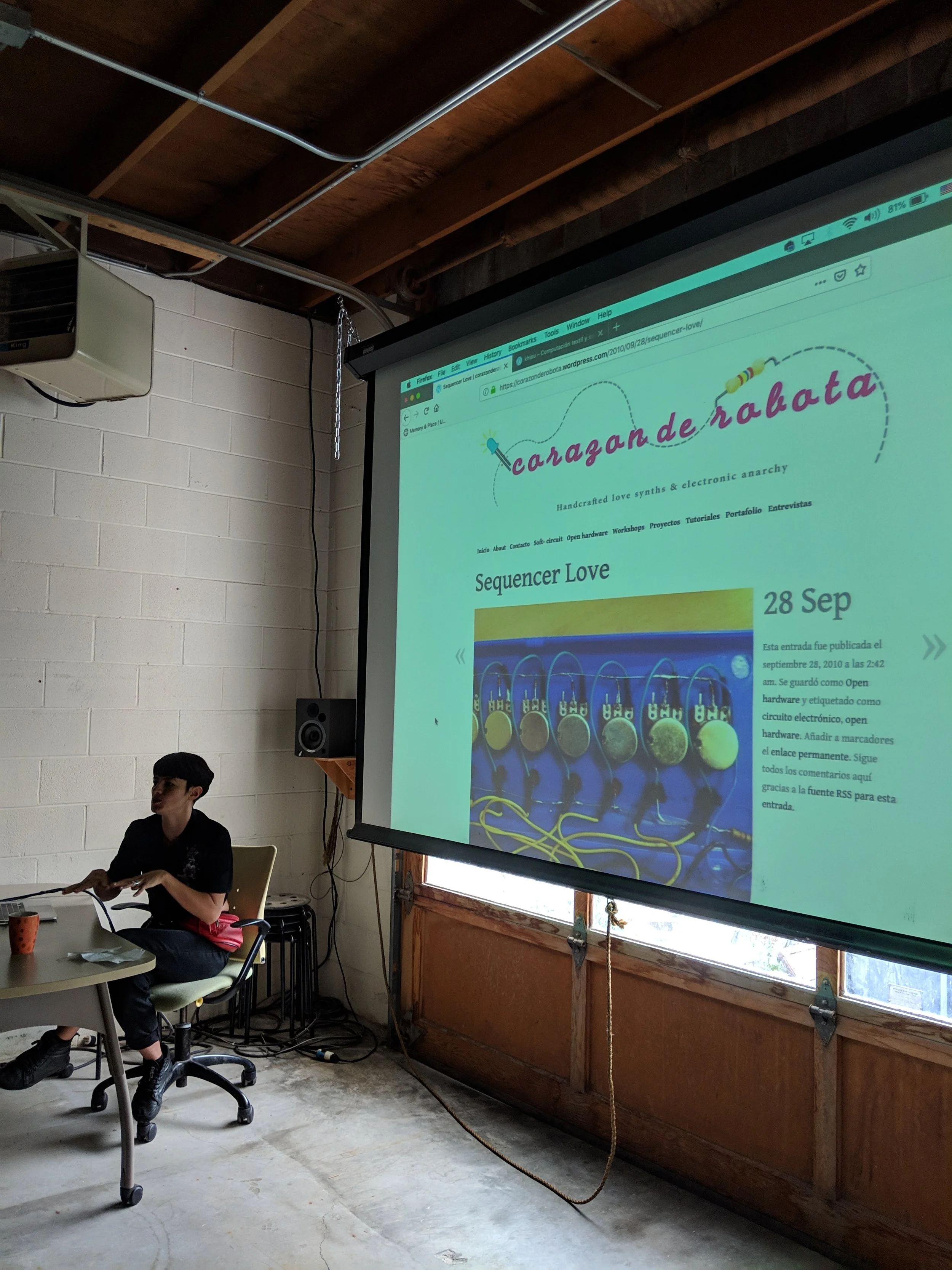 Constanza talking about her initiation in the field of diy electronics by showing her first sequencer.