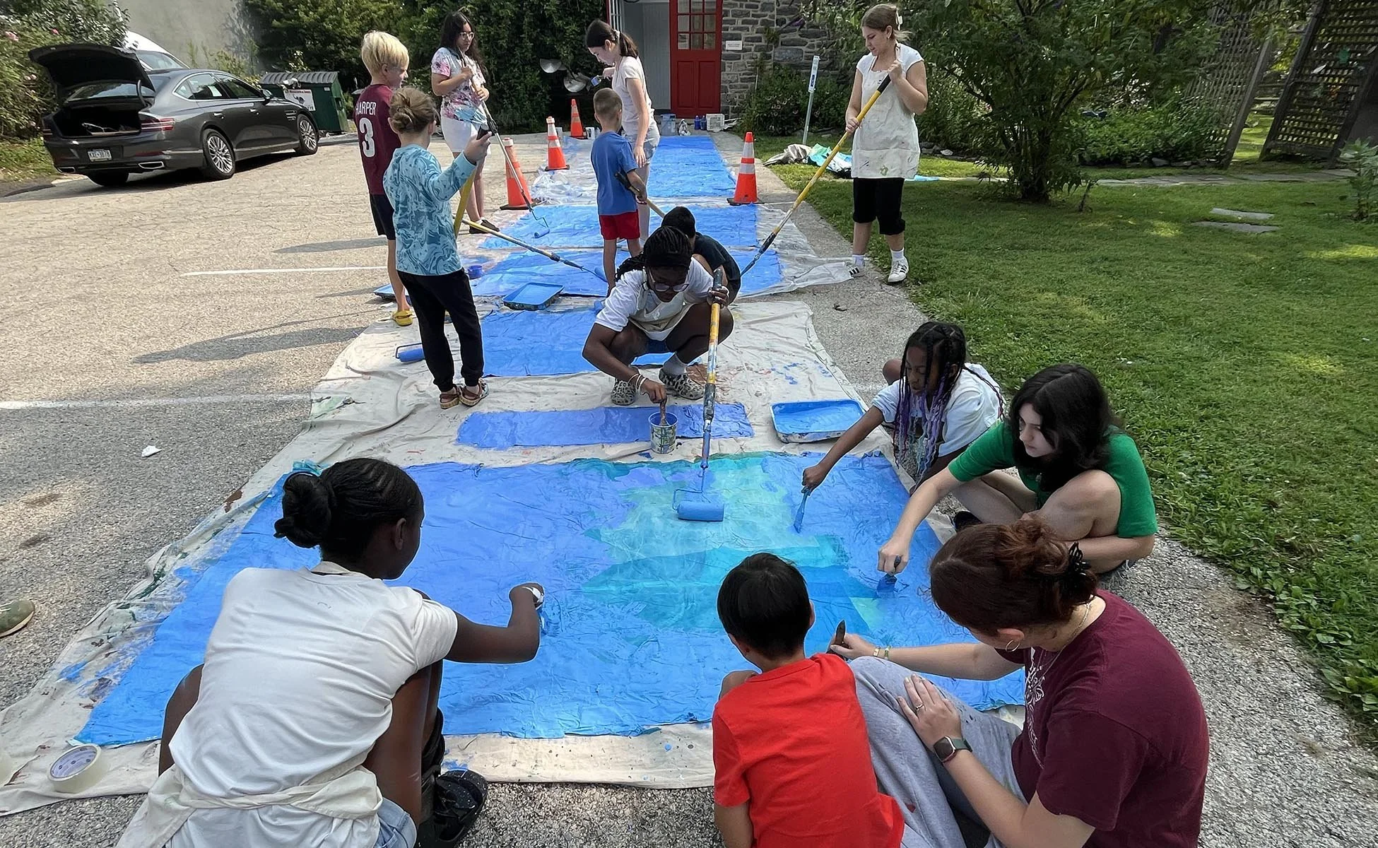   Artists took shifts preparing the surfaces, mixing the paint, rolling it on, and organizing our work area. Our group bonded by working together to accomplish a big task.  