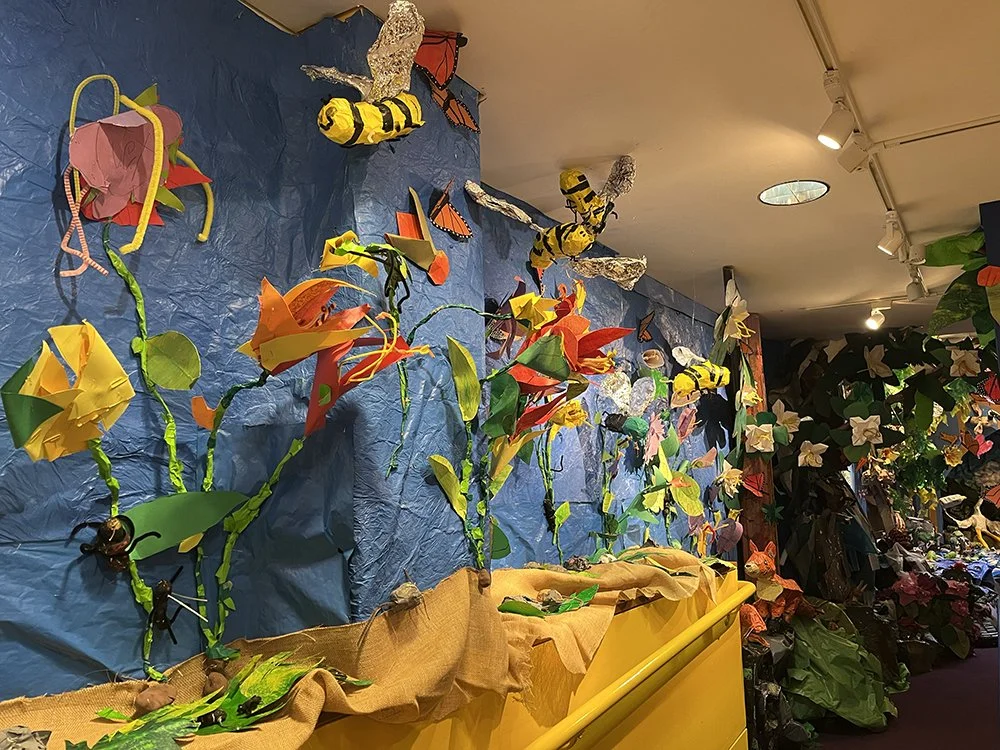   As part of my residency at H.A. Brown Elementary School, second graders  made trillium, trout lilies, Virginia bluebells, and bees to pollinate them,   