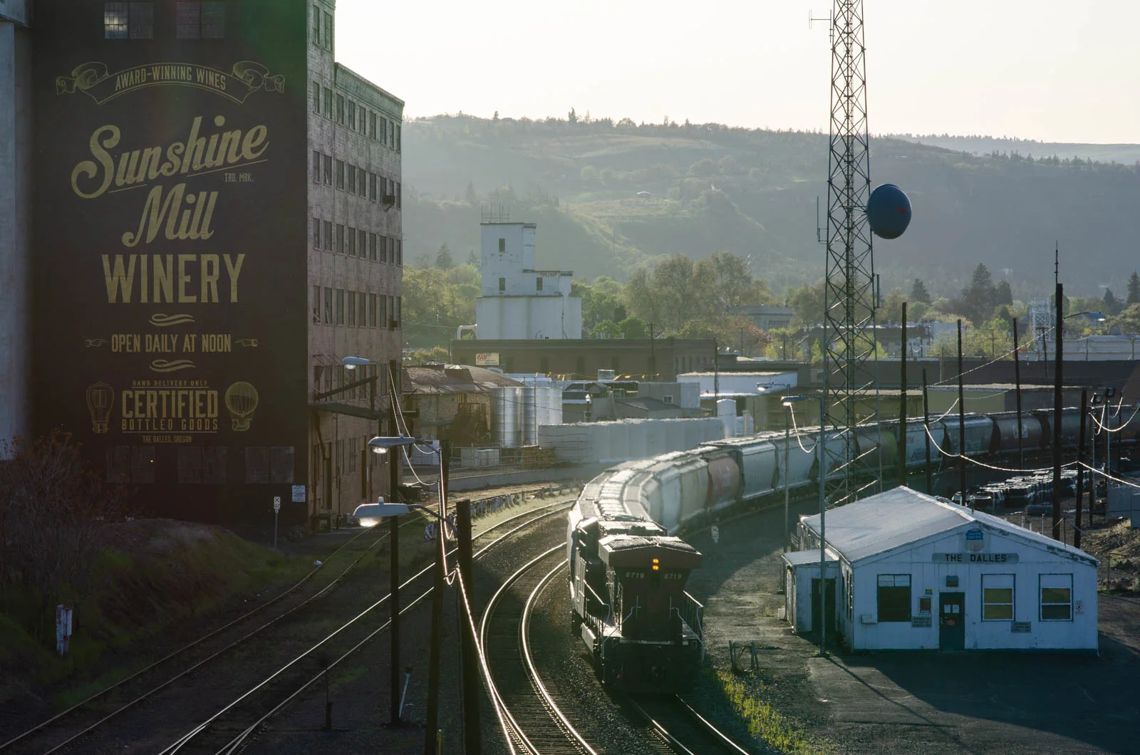Sunshine Mill Winery in The Dalles, Ore., lies just on the other side of the overpass from the AmeriTies West facility, where railroad ties treated with creosote off-gas in the yard while awaiting transport. The winery holds events in their outdoor amphitheater including movie nights in the summer.