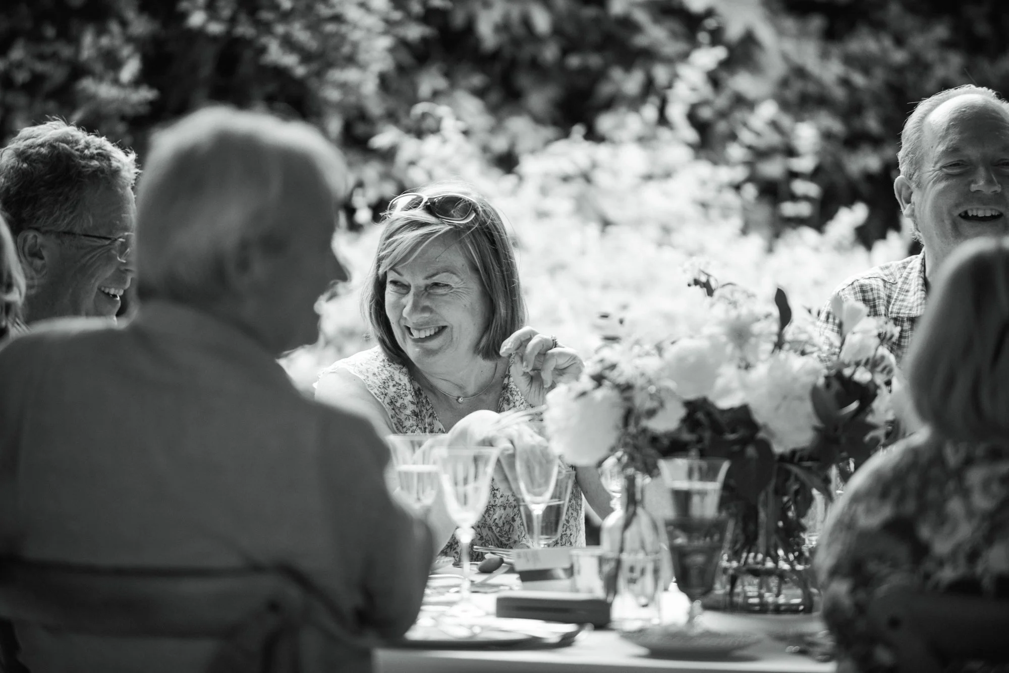 woman celebrating her birthday at a large outdoor party