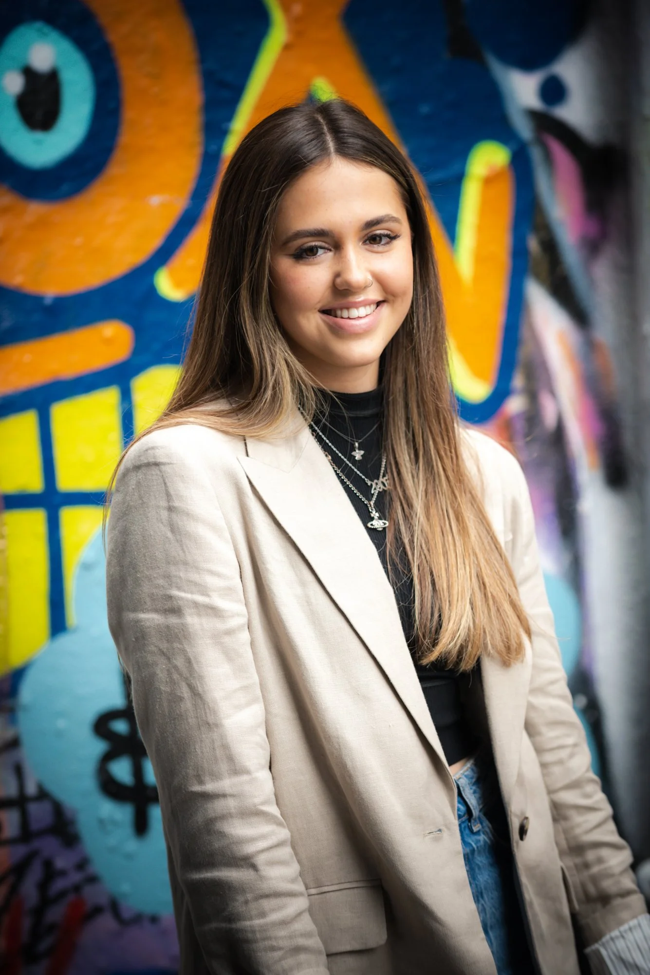 teen girl against graffiti wall in London