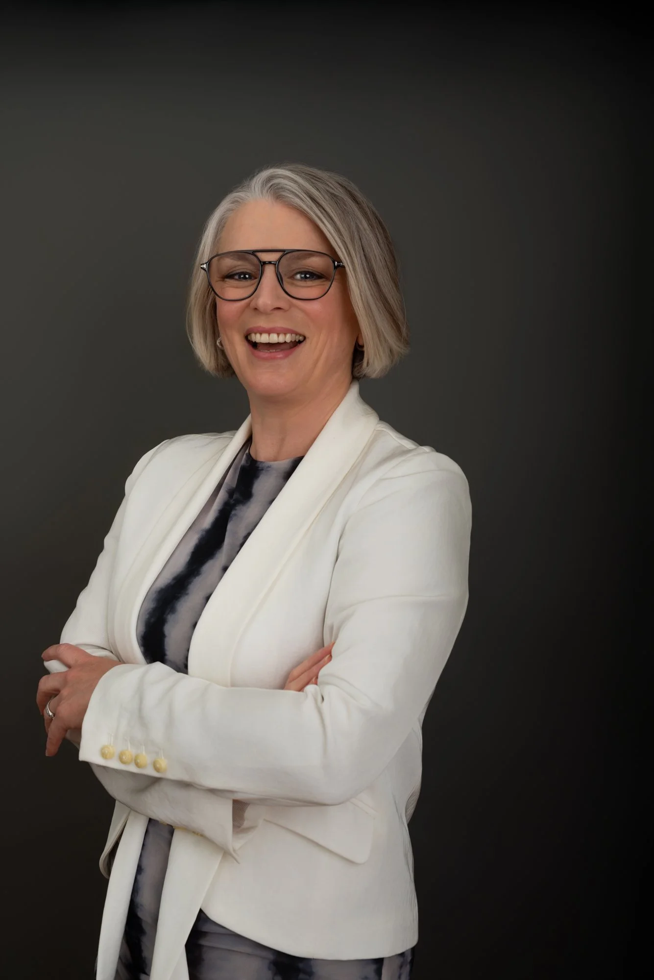 business woman with glasses and crossed arms