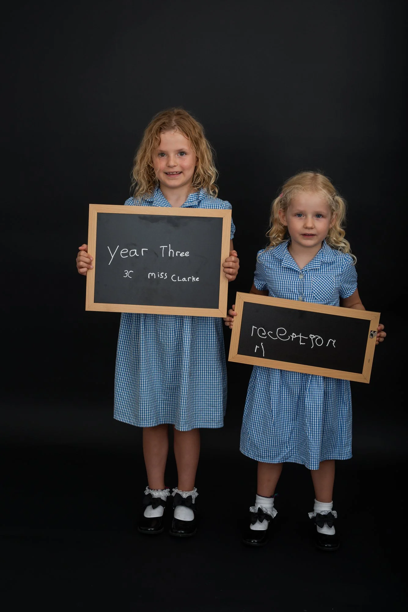 two school girls starting school photo shoot