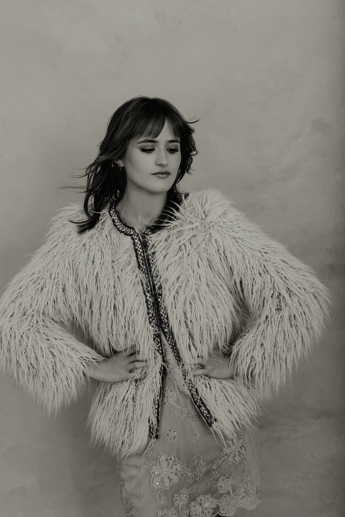 black and white photo of a girl celebrating her 21st birthday with a studio photo shoot