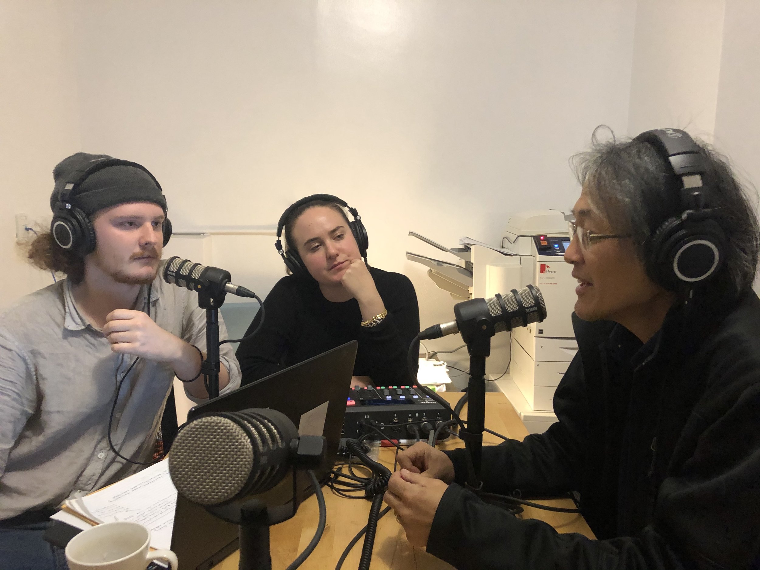 Two students listening to guest speaker in podcast room