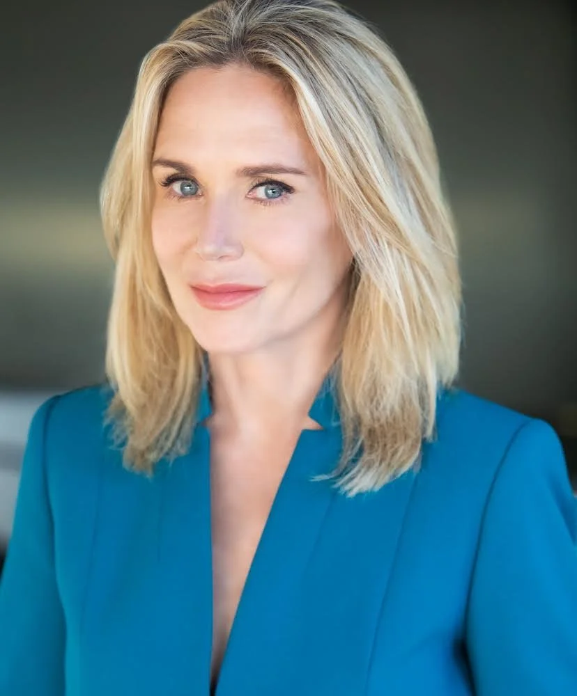 HEADSHOT SNEAKY SMILE.JPG