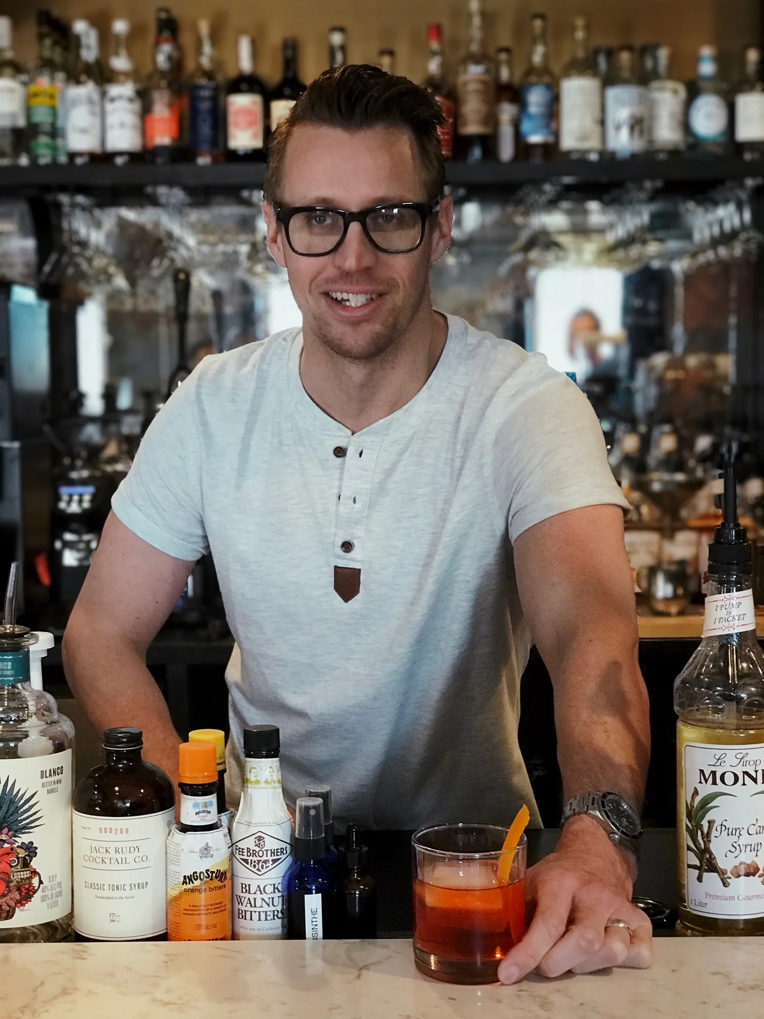 Owner and founder Cody Pellerin serving up his favorite cocktail, Plantation OFTD Negroni.