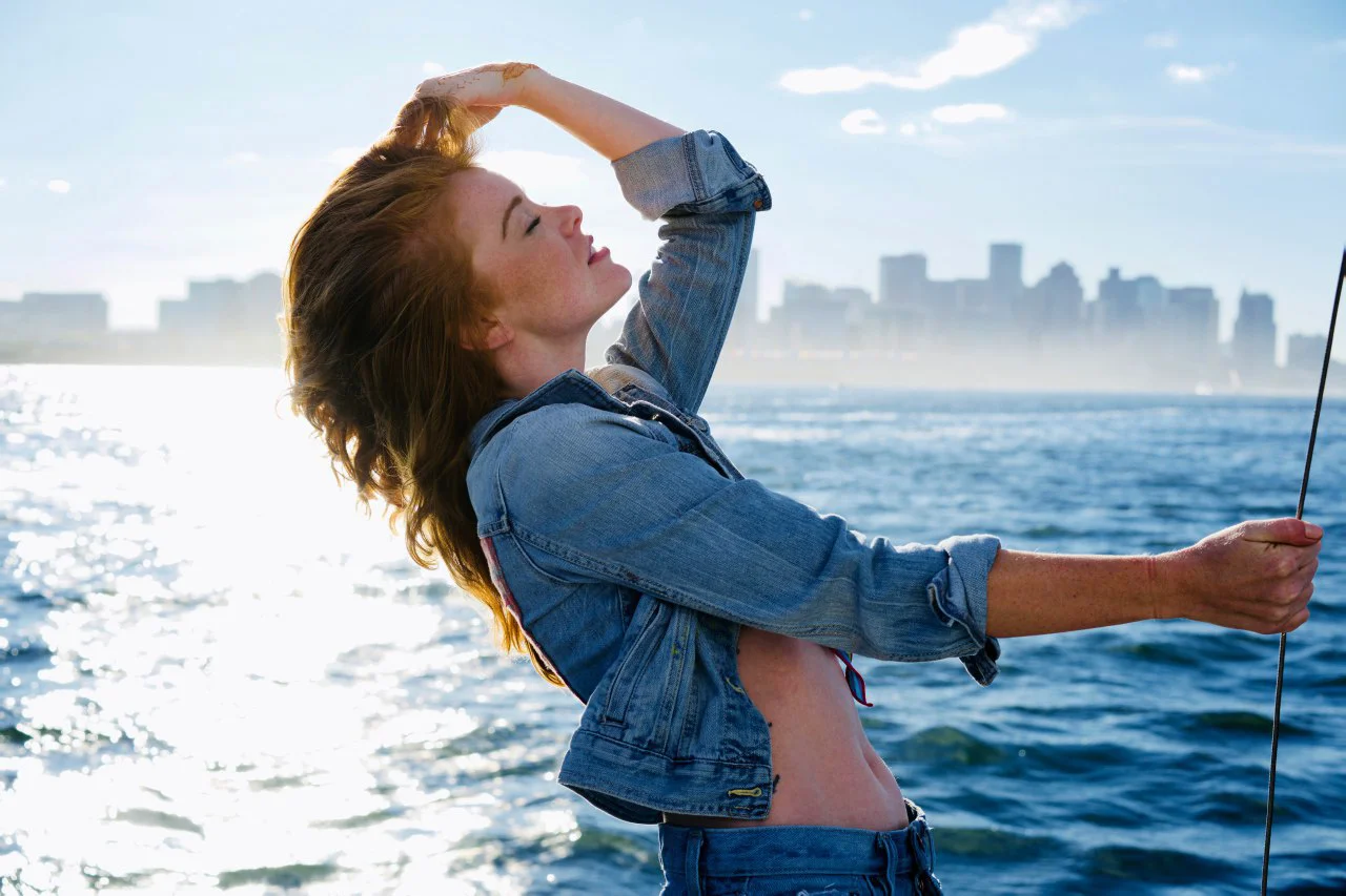 Kristina Dirksen enjoys a sea breeze that covers Boston in a light mist