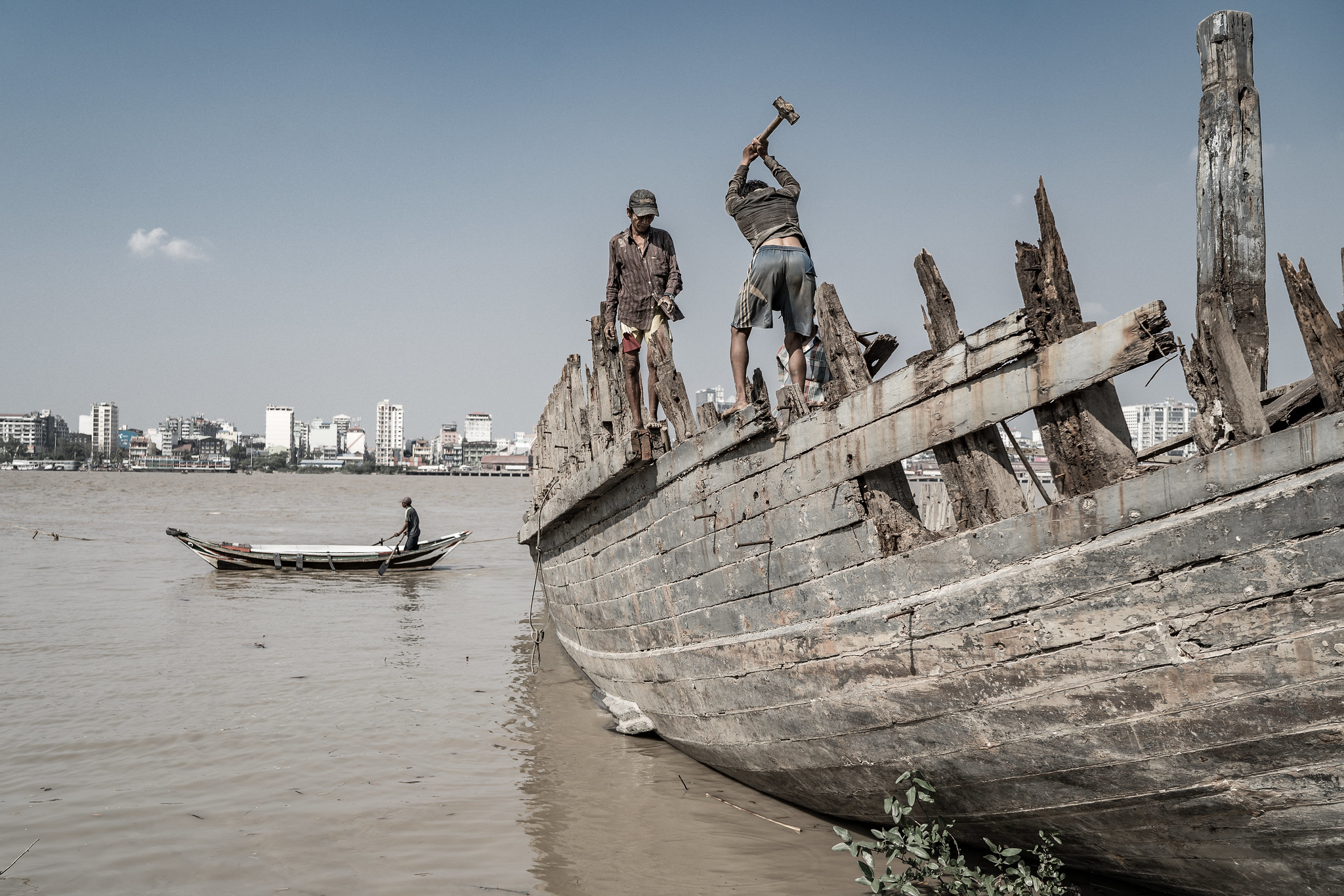 Myanmar scrapper on the Irrawaddy river finding a new use for the very ancient and very valuable hardwoods, unwittingly saving the felling of a tree that takes 100 years to mature.