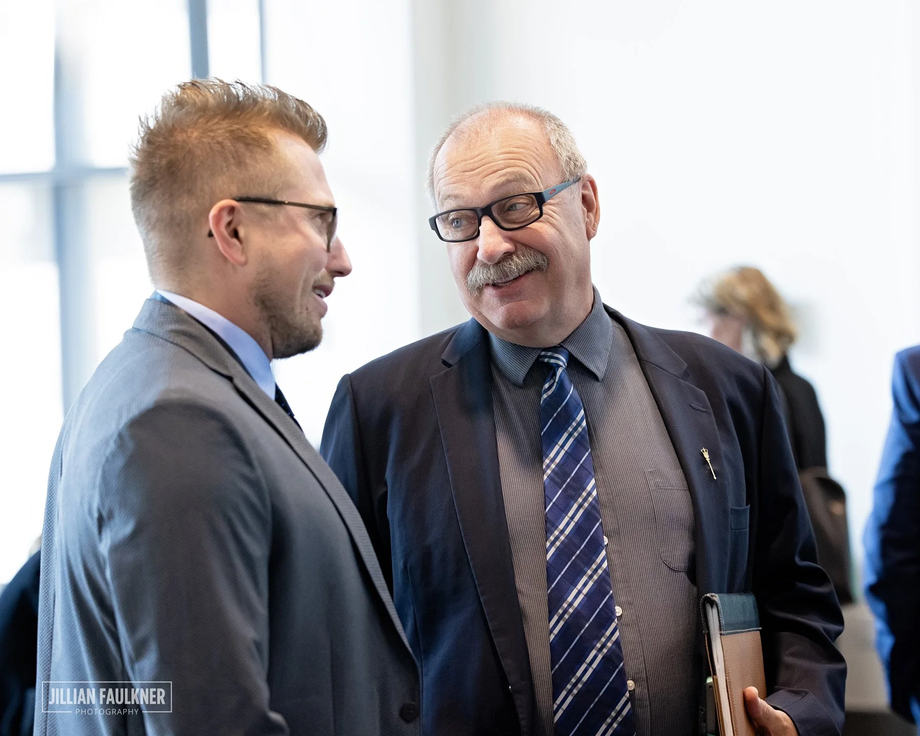 Experienced event photographer Calgary documents networking and candid moments at high profile political luncheon