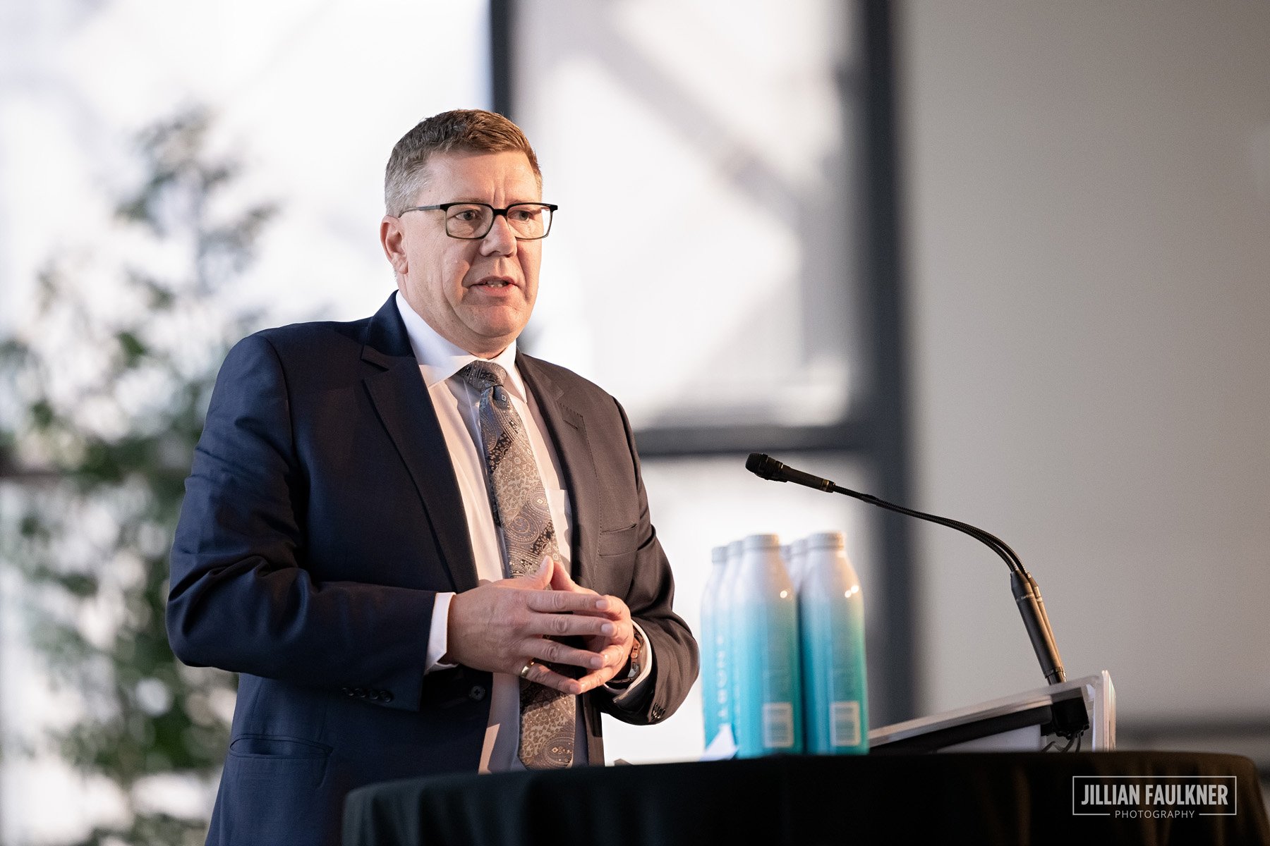 Premier Scott Moe addressing energy industry leaders at Calgary summit photographed by experienced Calgary event photographer