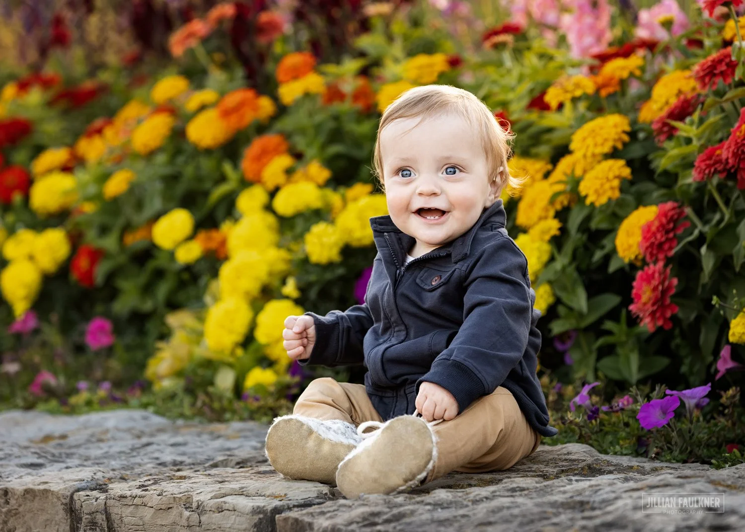 9 month old baby portrait outdoors at baker park in Calgary with flowers in the background