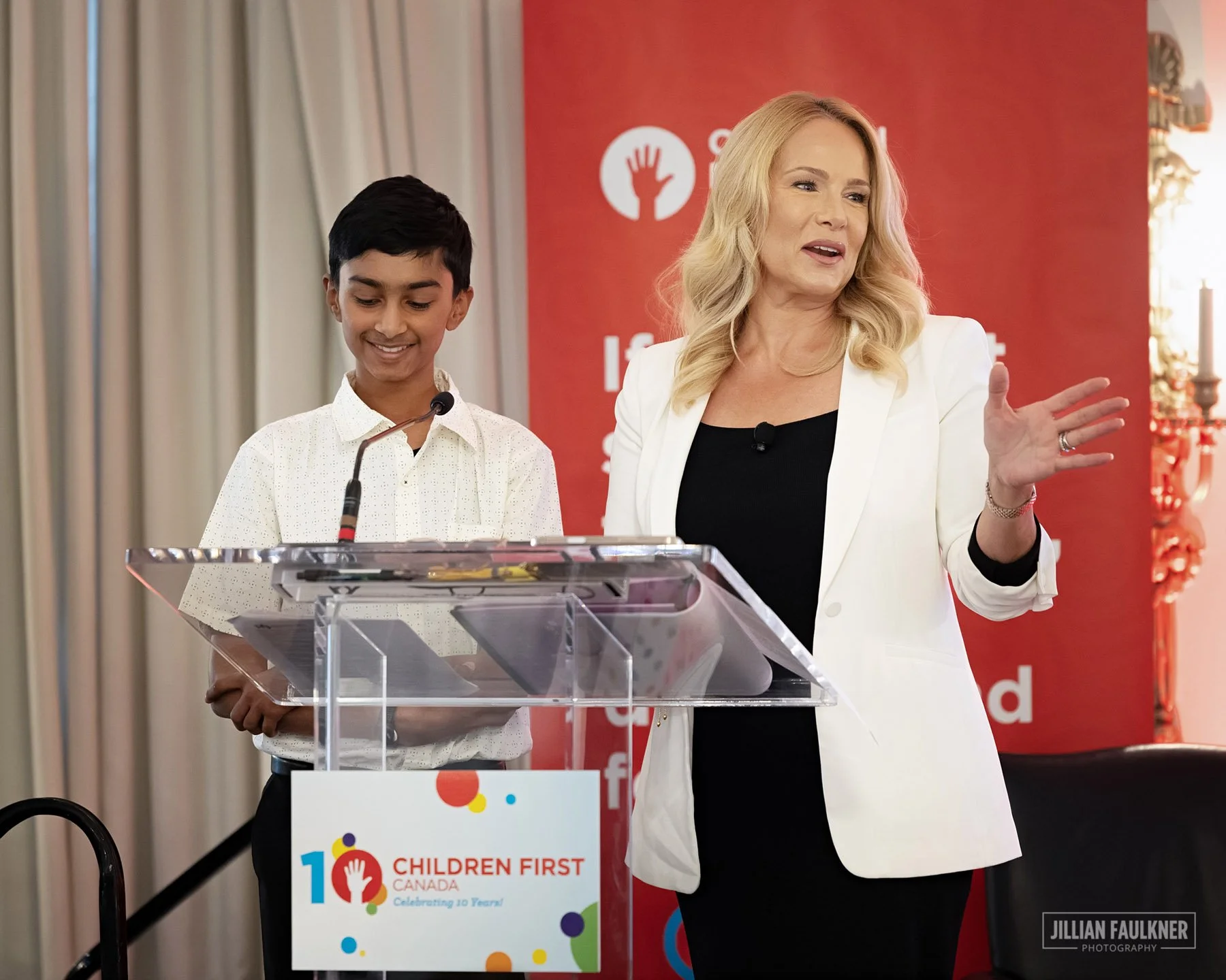 Calgary event photographer capturing keynote speaker portrait at podium