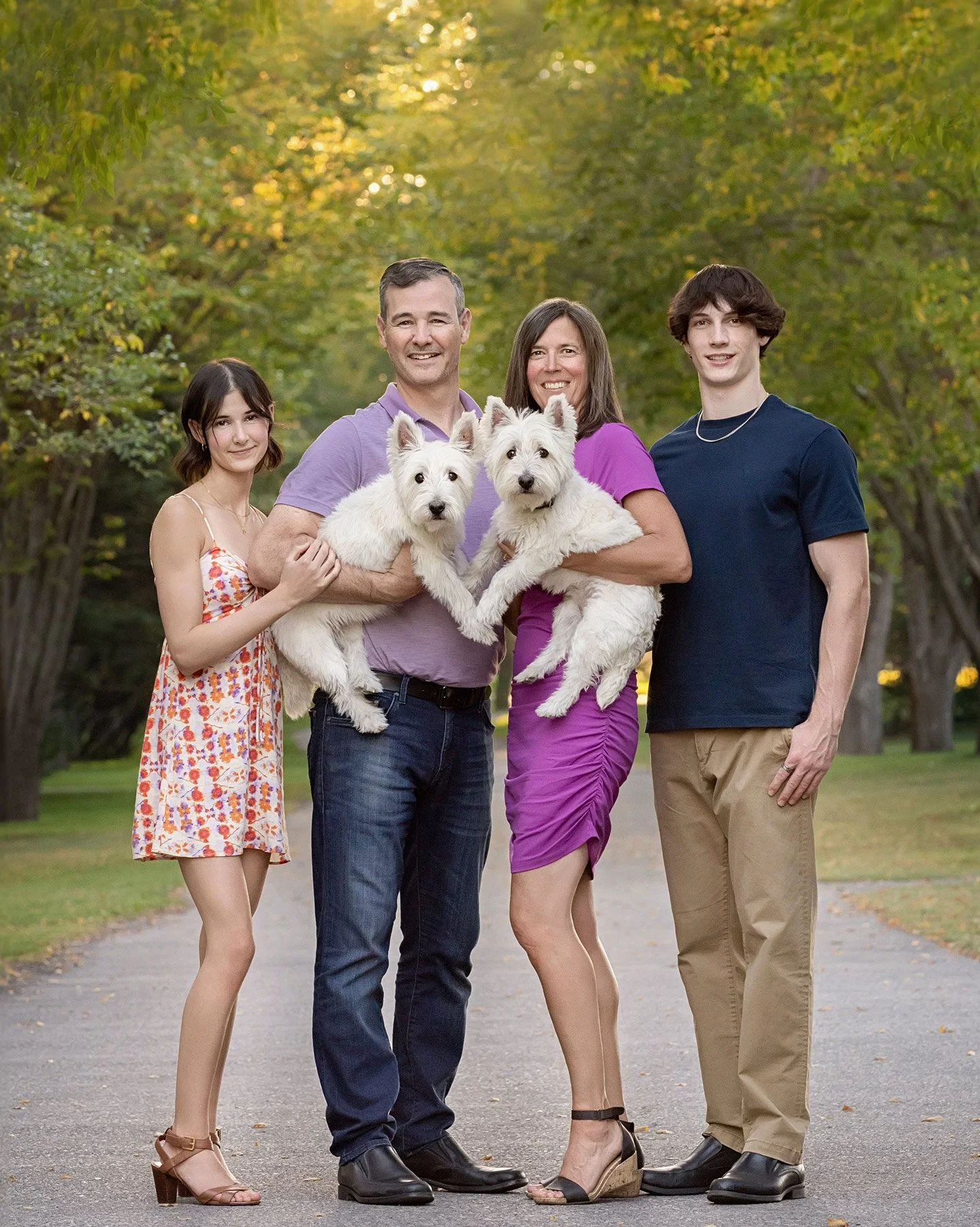 outdoor family photography session with parents and two teenage children along with two family dogs photographed at Baker Park