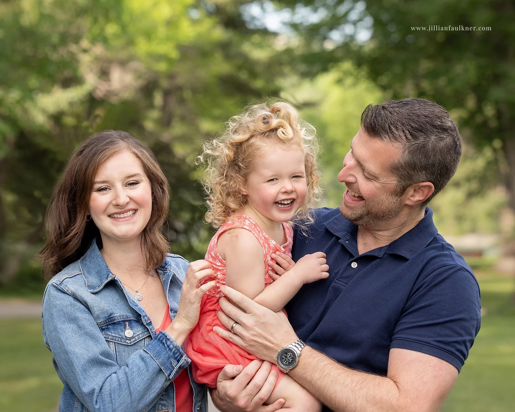 outdoor Calgary family photography heirloom portrait of a family of three laughing together