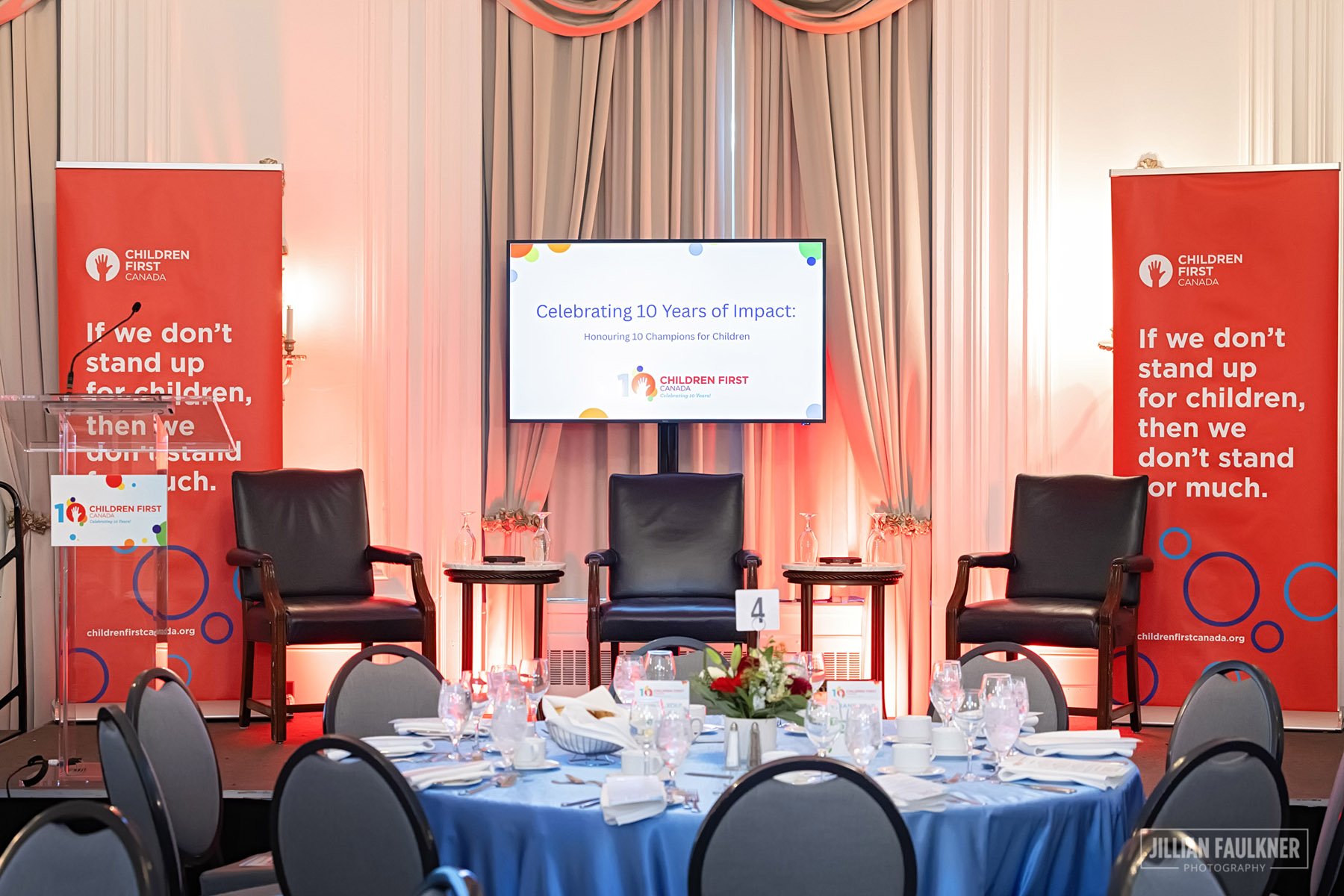 Styled place setting with wine glasses and linen napkins at Calgary gala luncheon