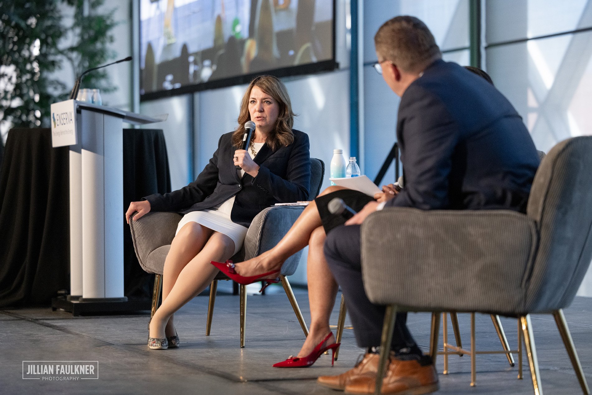 High quality corporate event photography of Premier Smith on stage at Calgary energy industry conference