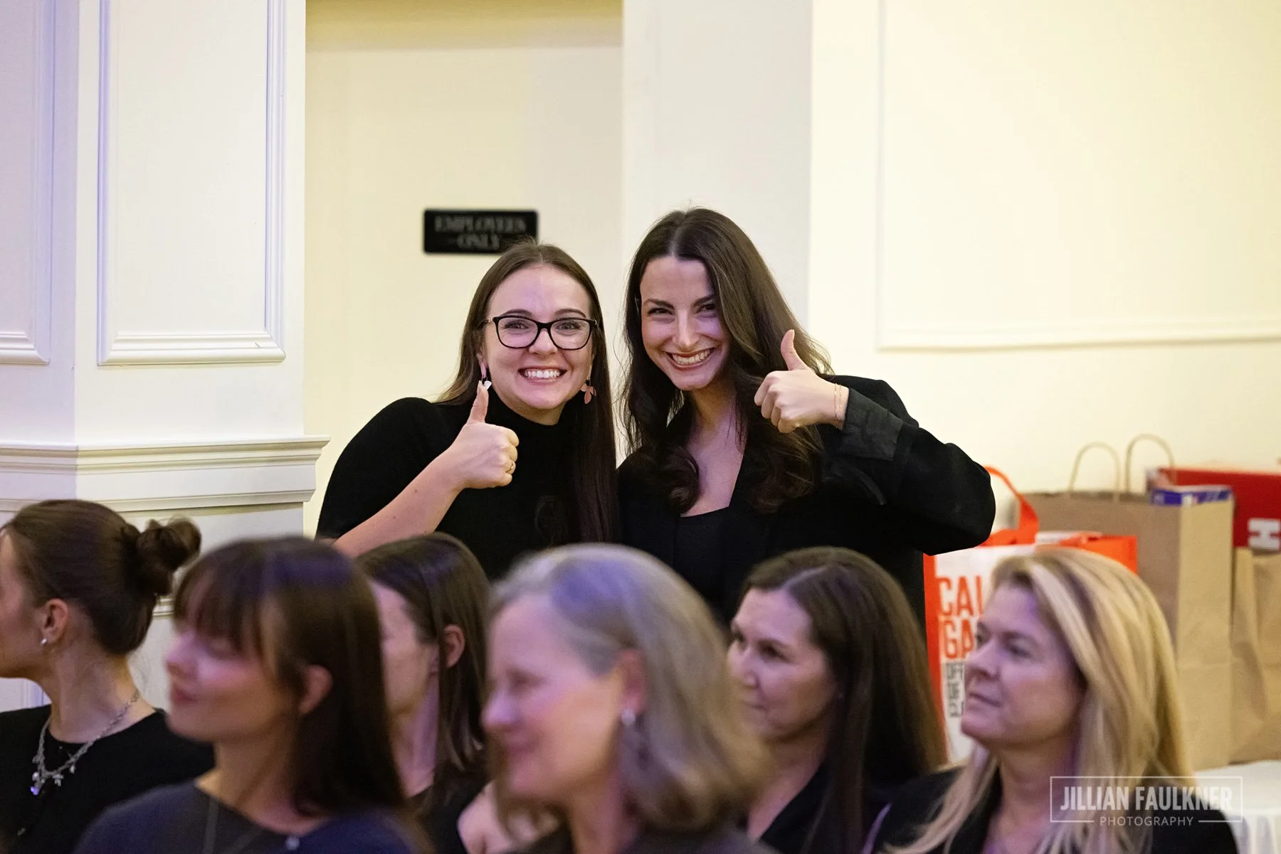 two females giving a thumbs up to the Calgary event photographer