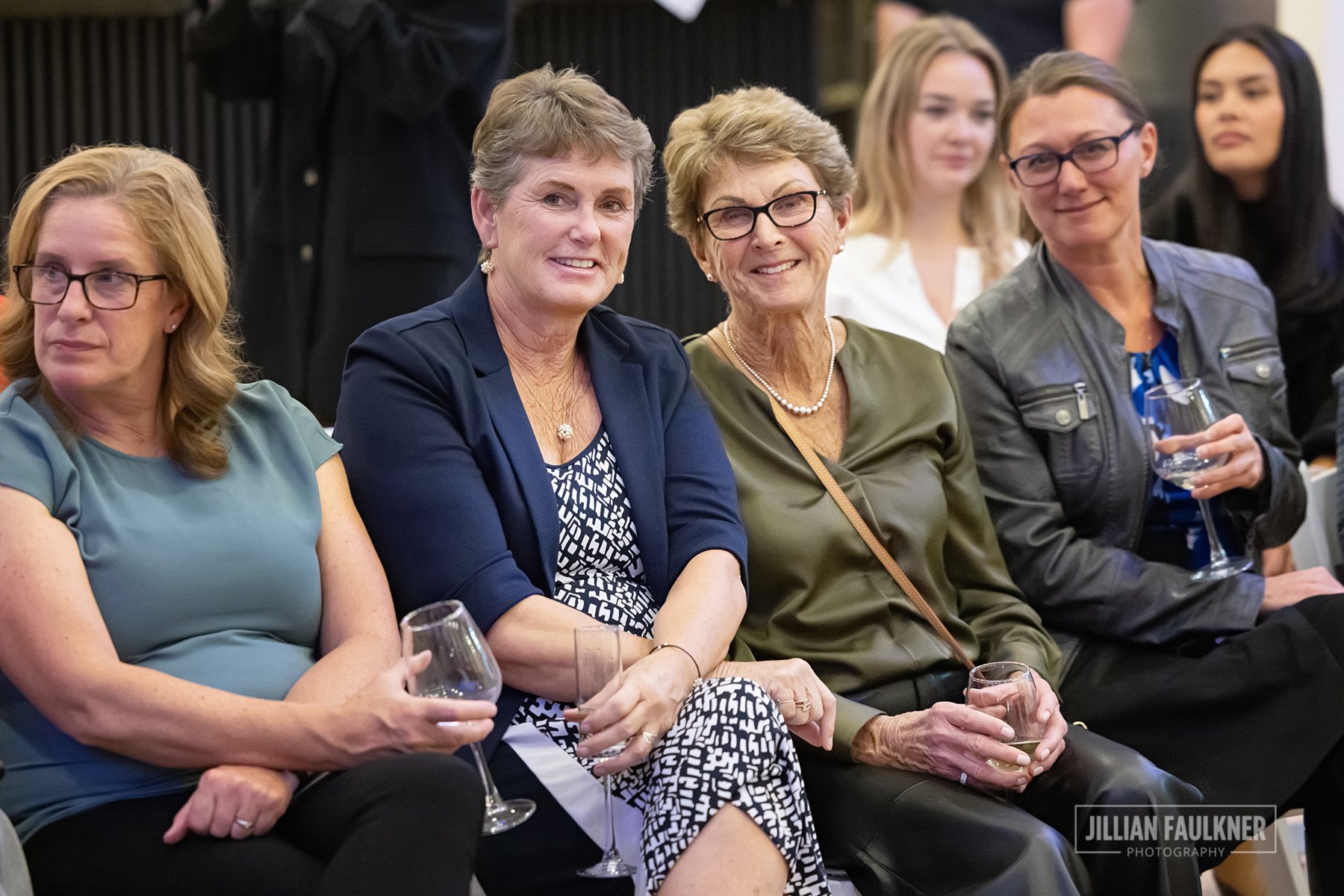 candid portraits of guests enjoying the fashion show