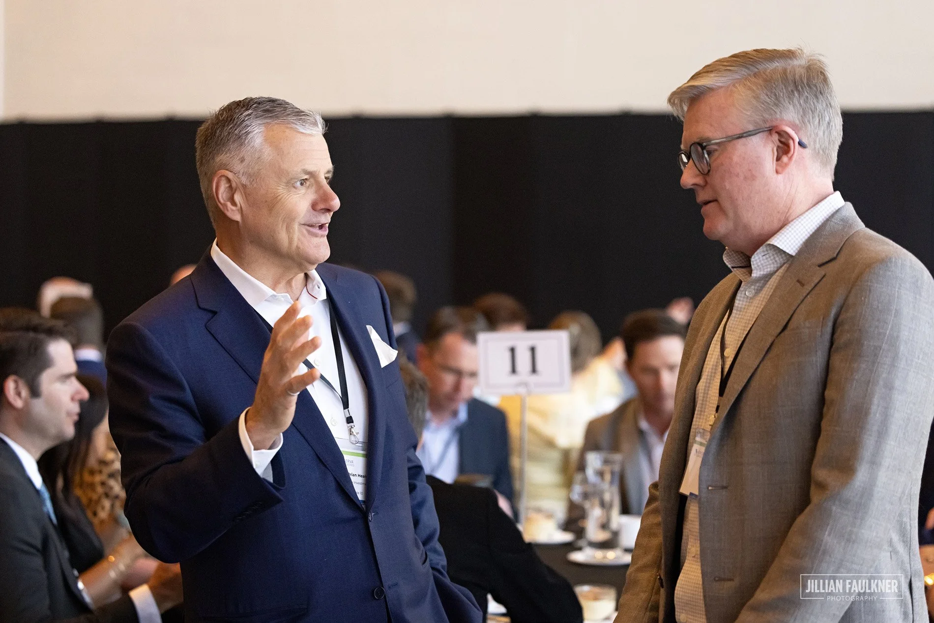 Professional Calgary event photographer documents authentic networking moments between oil and gas industry professionals at Telus Convention Centre Calgary