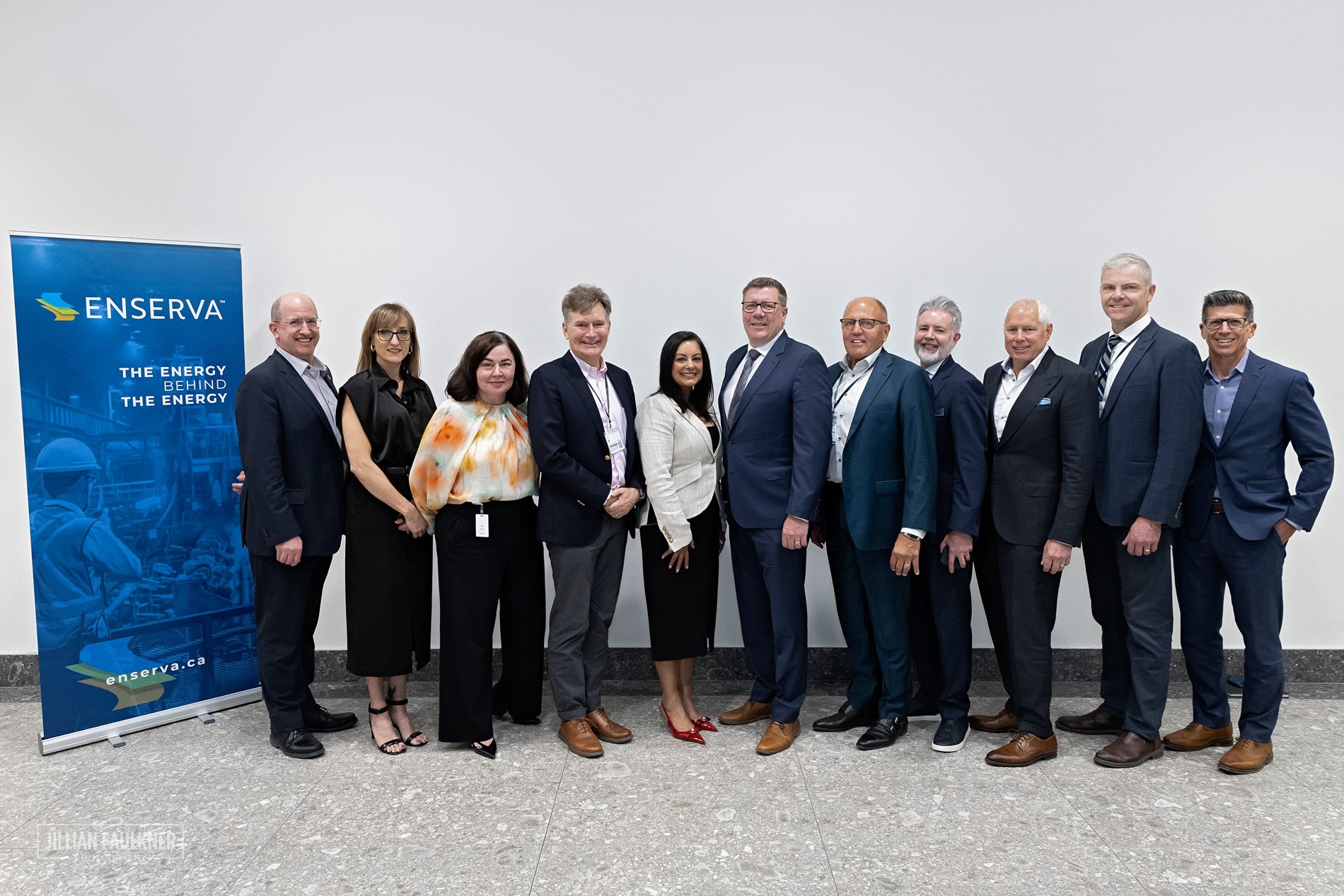 Calgary event photographer with 15 years experience capturing group photo of Enserva team with Premier Scott Moe