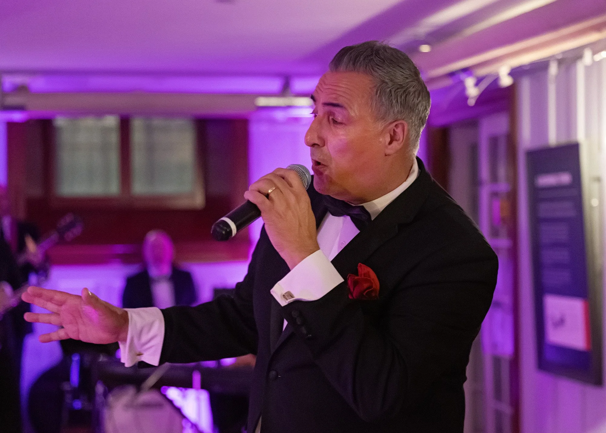 live band atmosphere during post-speech celebration at historic Lougheed House private anniversary gala