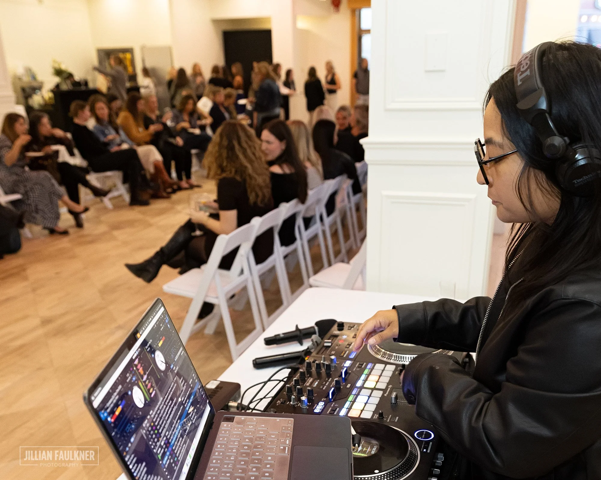 Calgary-event-photographer-capturing-female-DJ-detail-shots-during-fashion-show-break