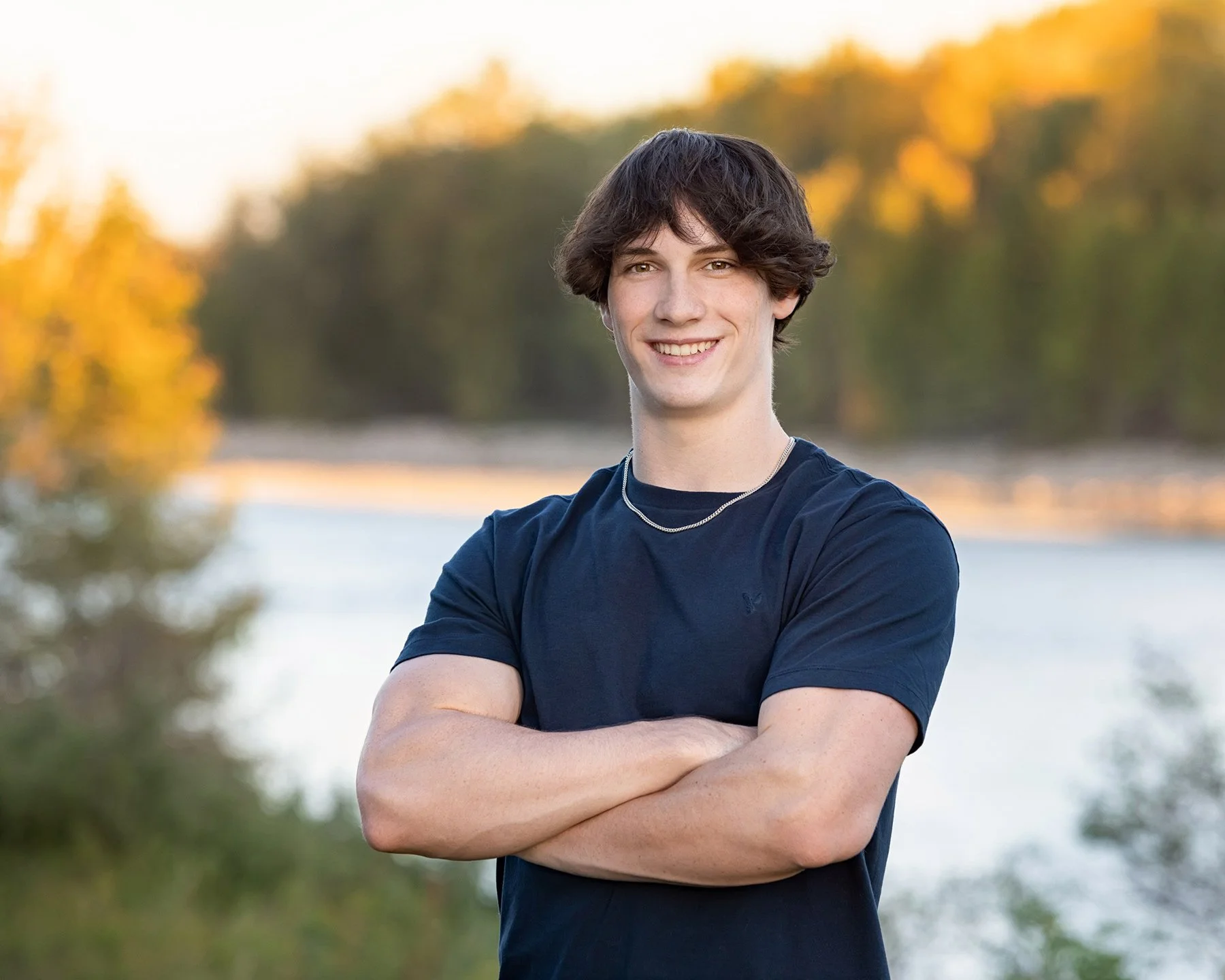 teenage boy portrait overlooking the Bow river during golden hour