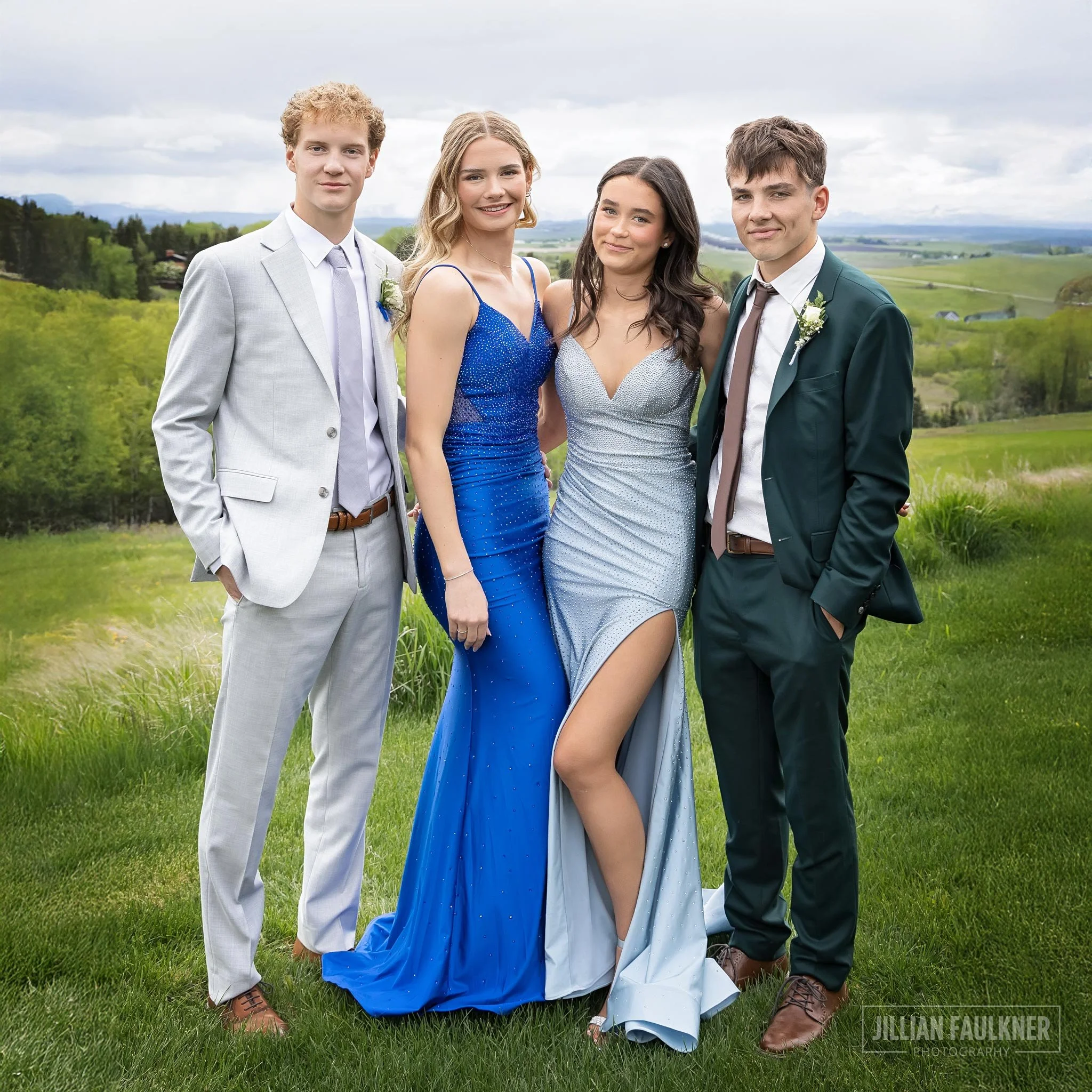 graduation photography portrait of two grad couples outdoors with rocky mountains in the background