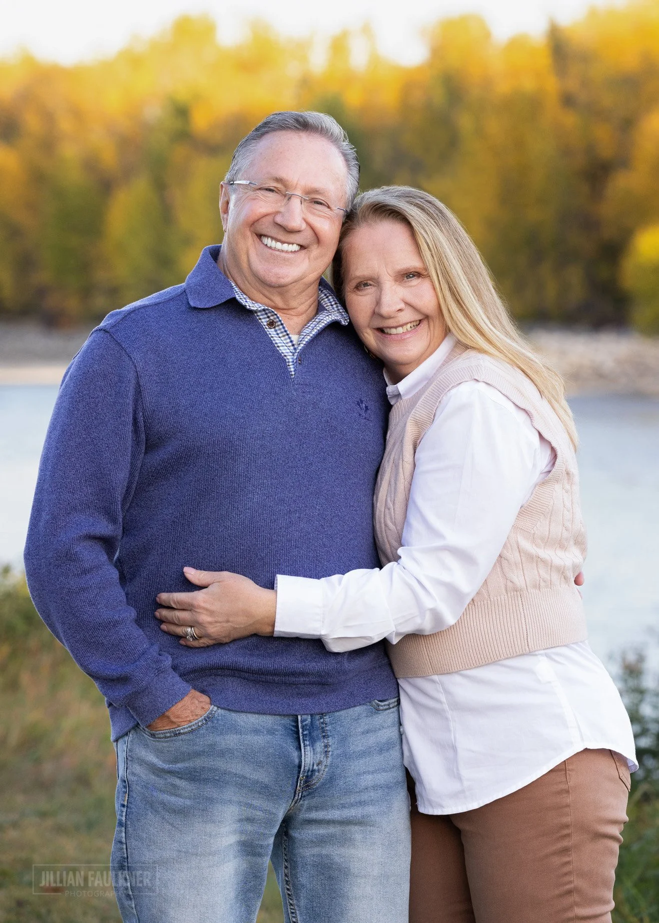 outdoor fall family photo of grandparents by the Bow River in Calgary
